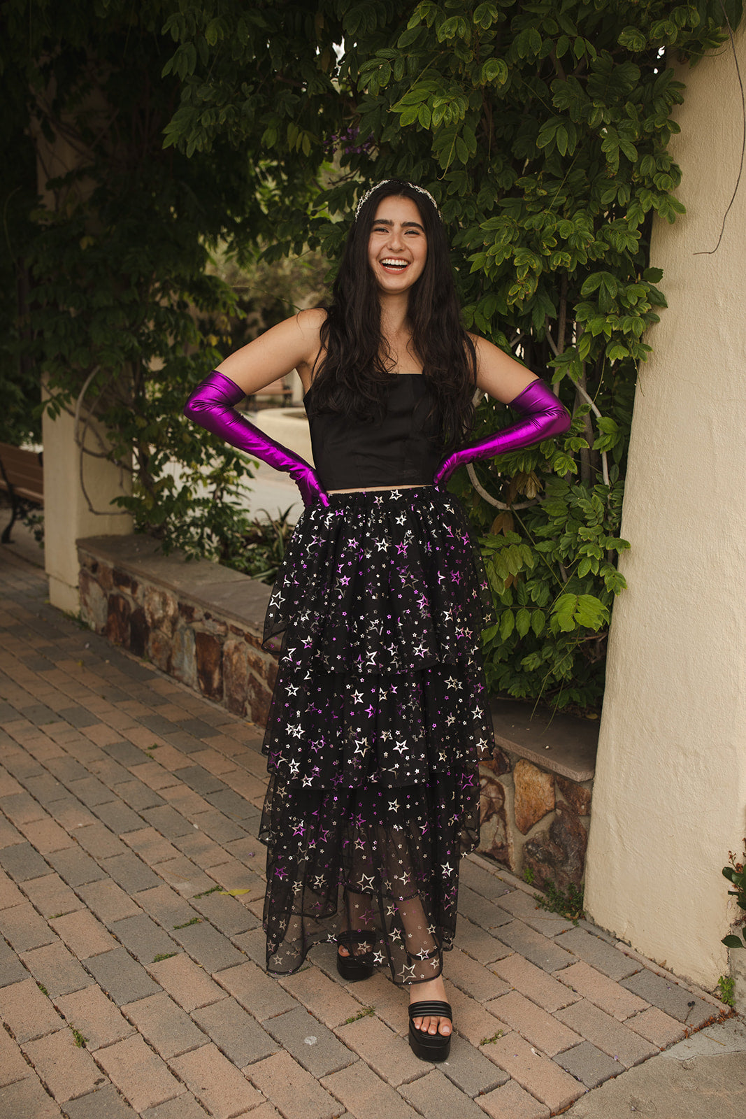 A tiered maxi skirt. Crafted with four tiers of layered black and metallic silver/purple stars and an elastic waist for all-day comfort. High waist with ankle hem.