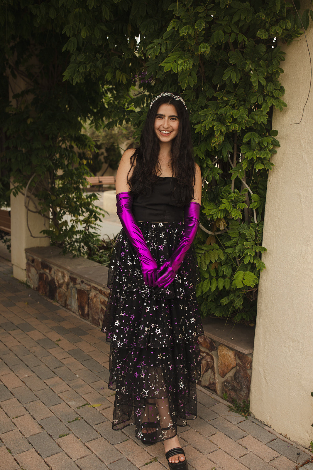 A tiered maxi skirt. Crafted with four tiers of layered black and metallic silver/purple stars and an elastic waist for all-day comfort. High waist with ankle hem.