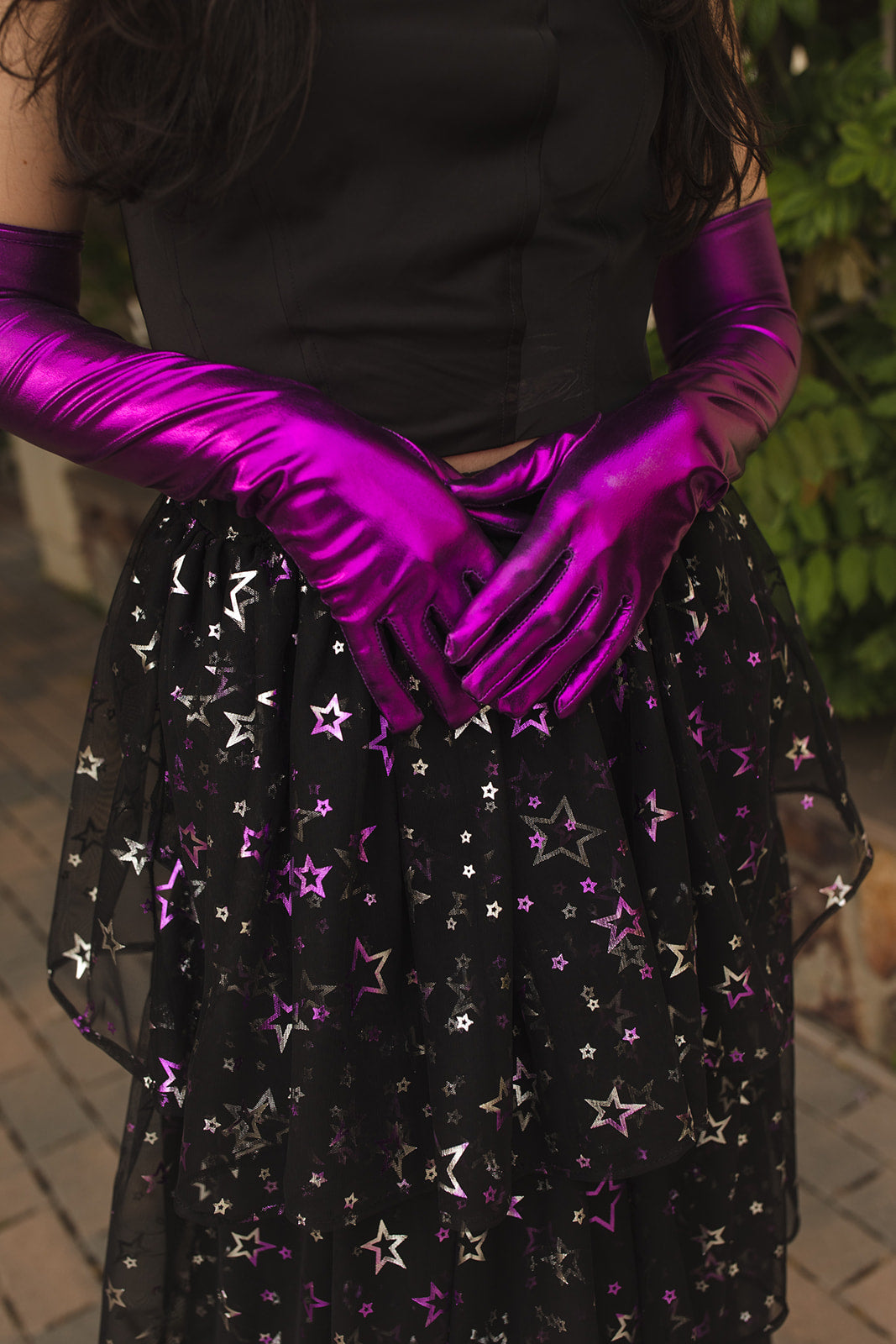 A tiered maxi skirt. Crafted with four tiers of layered black and metallic silver/purple stars and an elastic waist for all-day comfort. High waist with ankle hem.