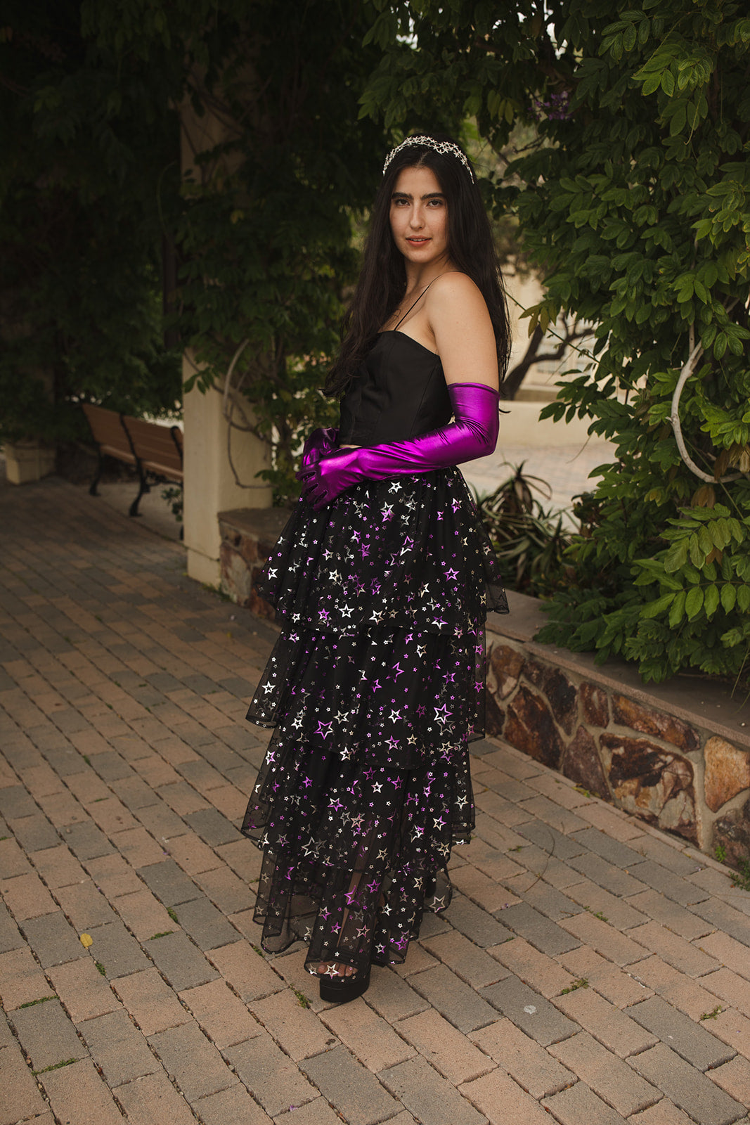 A tiered maxi skirt. Crafted with four tiers of layered black and metallic silver/purple stars and an elastic waist for all-day comfort. High waist with ankle hem.