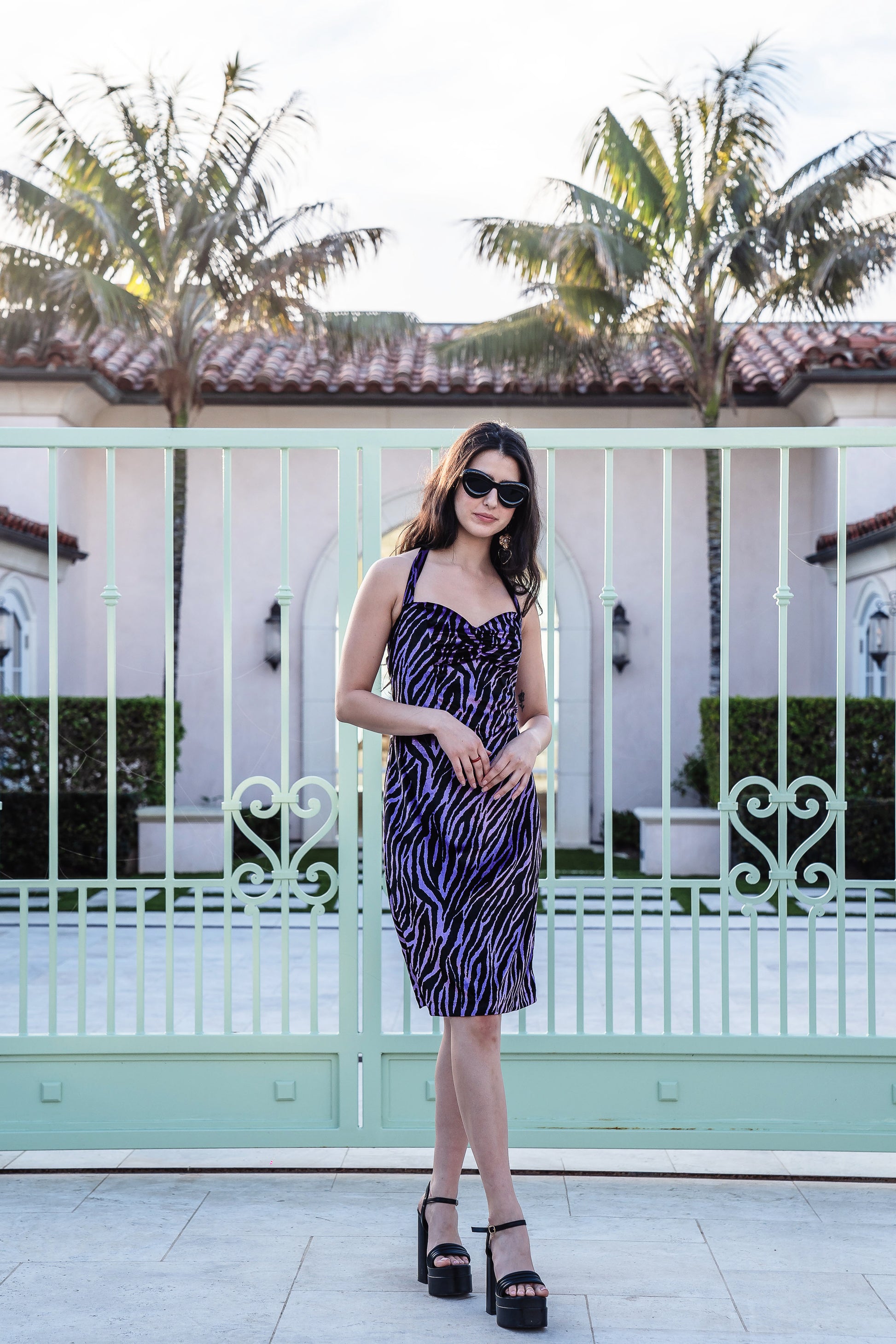 The Betty Tiger Halter dress by Jennafer Grace combines sleek and retro sexy with a touch of glamour. The velveteen, bodycon design accentuates your curves, while the elastic shirred back bust allows for flexibility in between sizes.