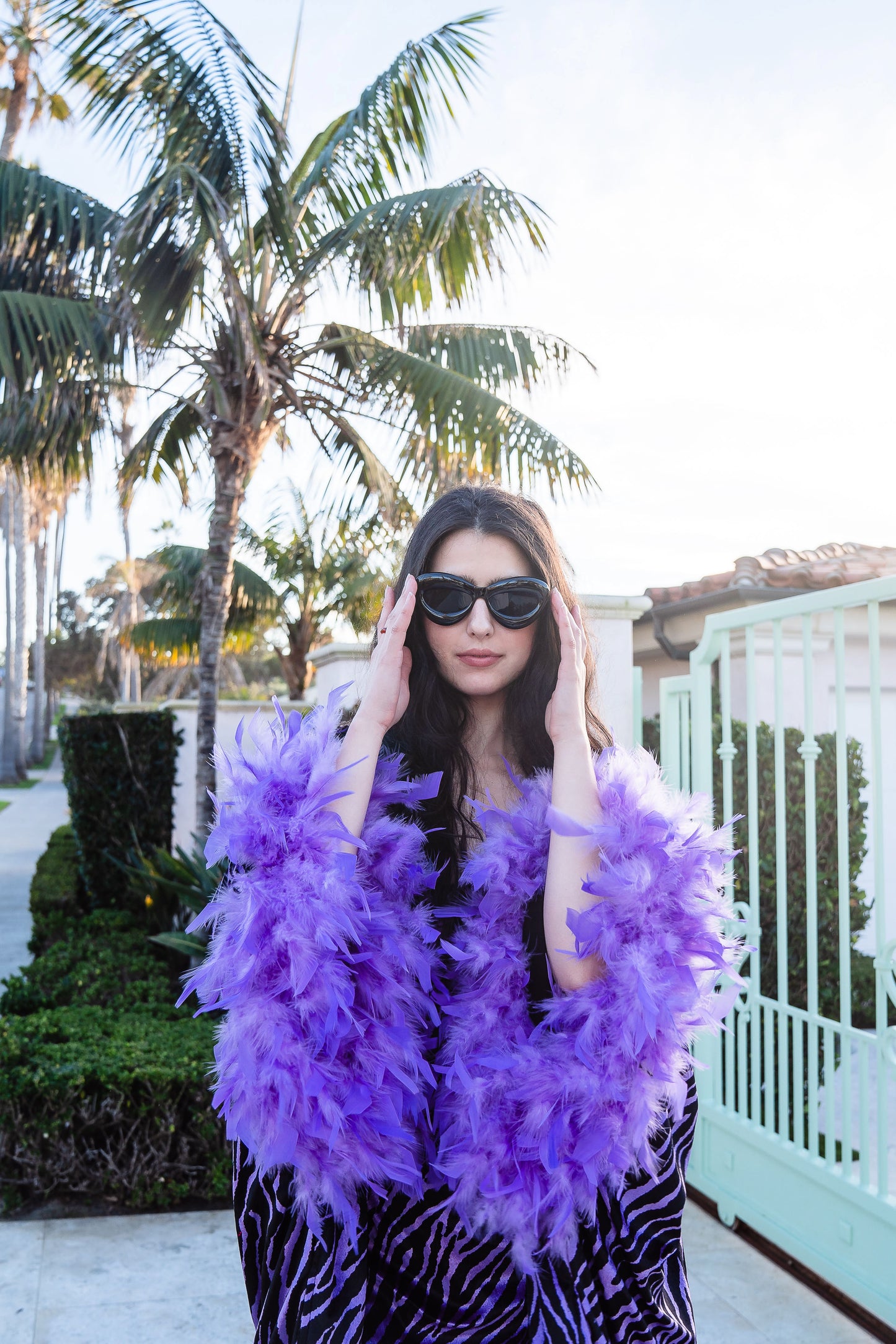 Velvet zebra print overcoat with periwinkle purple. Featuring light purple feathers around sleeve hem, two hook and eye closures at neck and bust. Batwing sleeves with lots of flow and room. Ankle length hem.