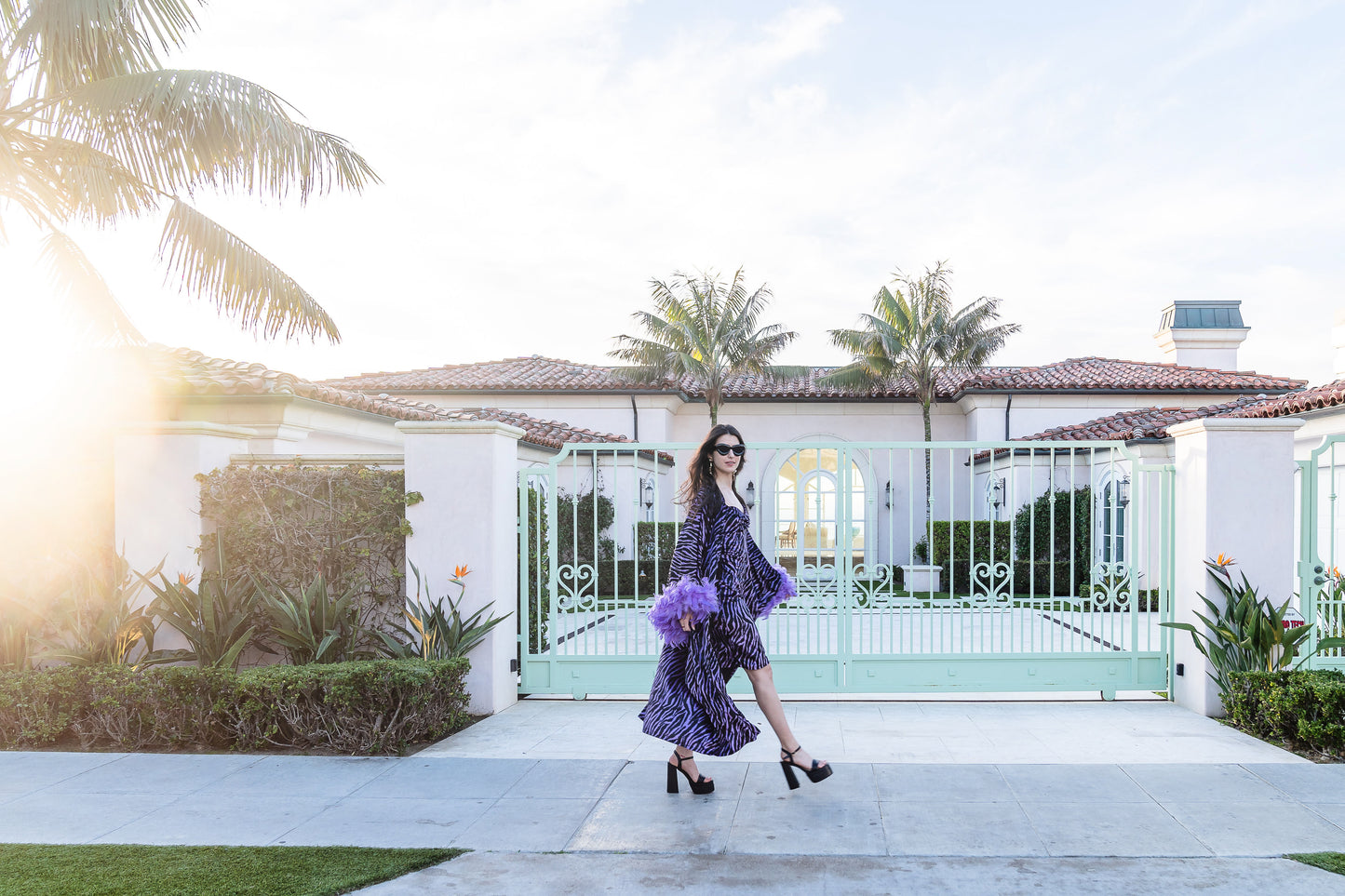 Velvet zebra print overcoat with periwinkle purple. Featuring light purple feathers around sleeve hem, two hook and eye closures at neck and bust. Batwing sleeves with lots of flow and room. Ankle length hem.