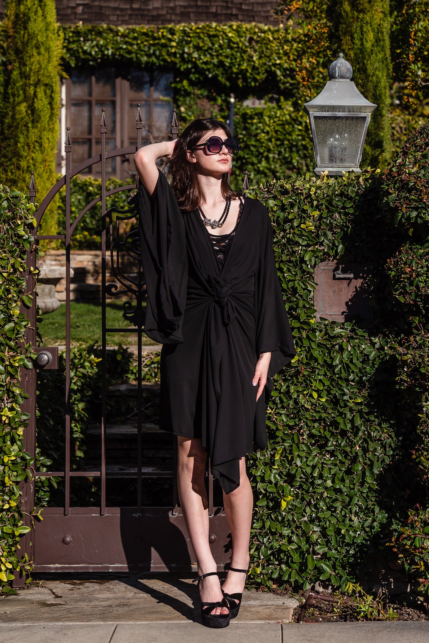 Jennafer Grace solid black fashion kimono robe. Featuring a wrap tie waist for a cinched look, v-neck, square sleeves, and an ankle length hem. Classic, bohemian retro aesthetic.
