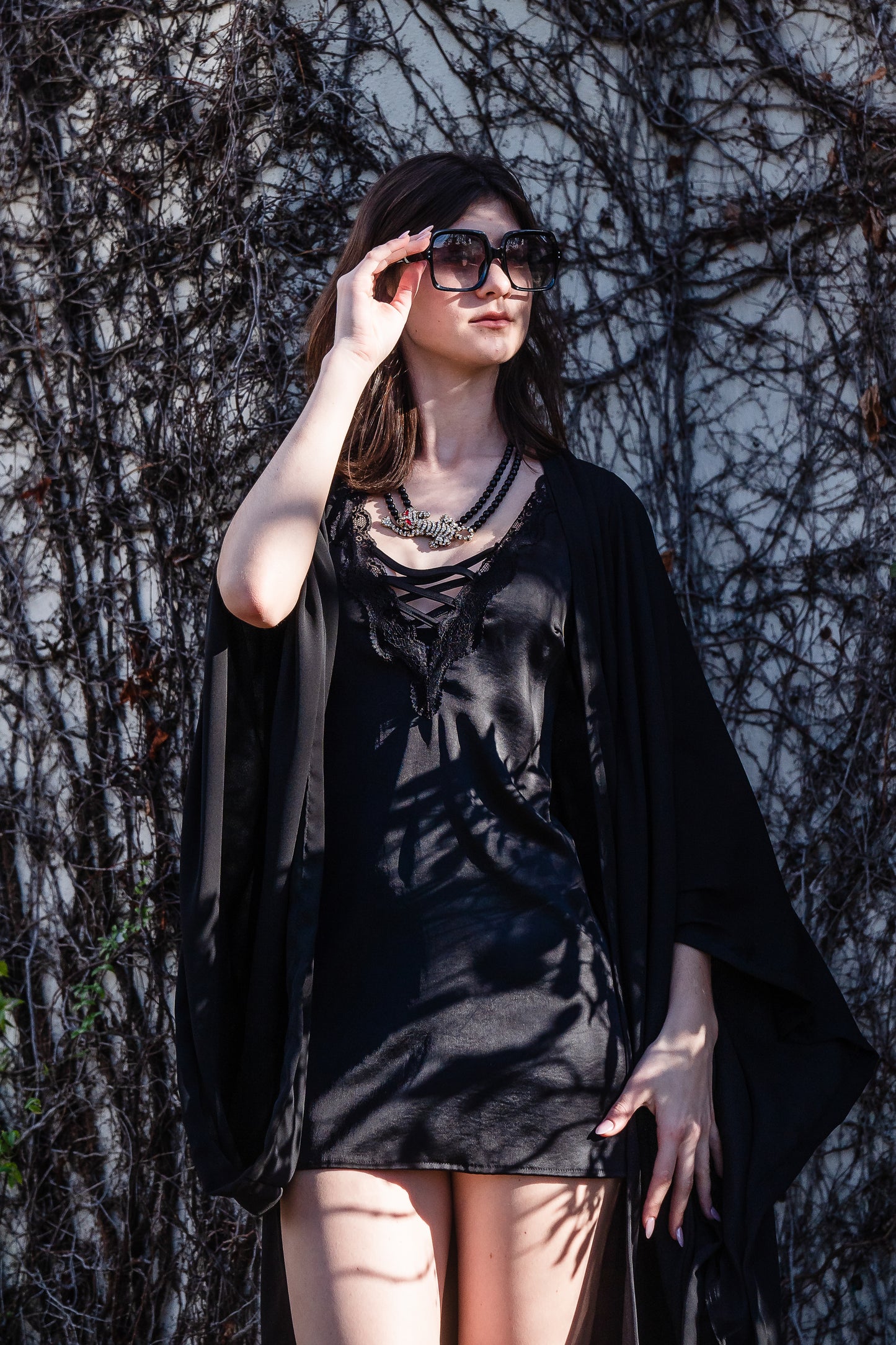 Jennafer Grace solid black fashion kimono robe. Featuring a wrap tie waist for a cinched look, v-neck, square sleeves, and an ankle length hem. Classic, bohemian retro aesthetic.