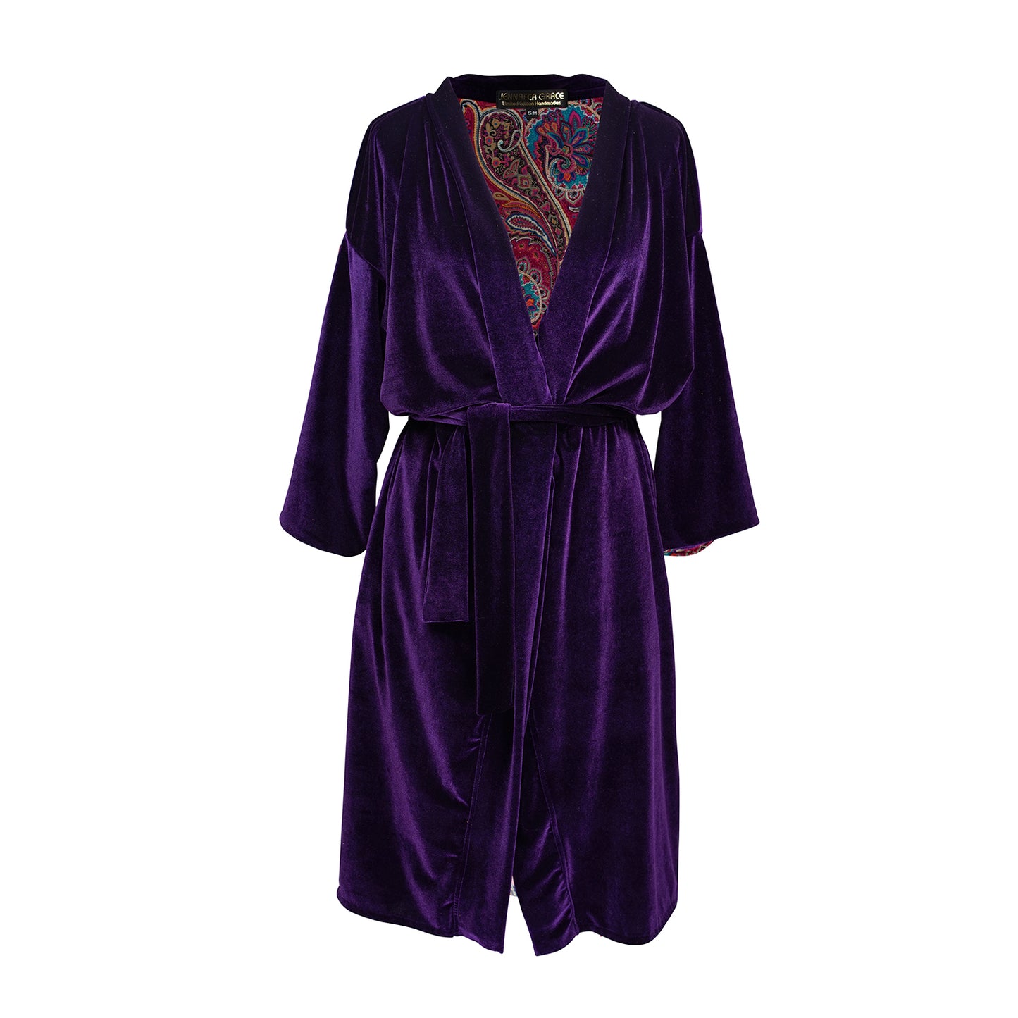 Reversible purple velvet knee length kimono with narrow sleeves, it has tie belt at the waist, the lining is pink and purple paisley printed chiffon, lining is shown at the turned up cuffs