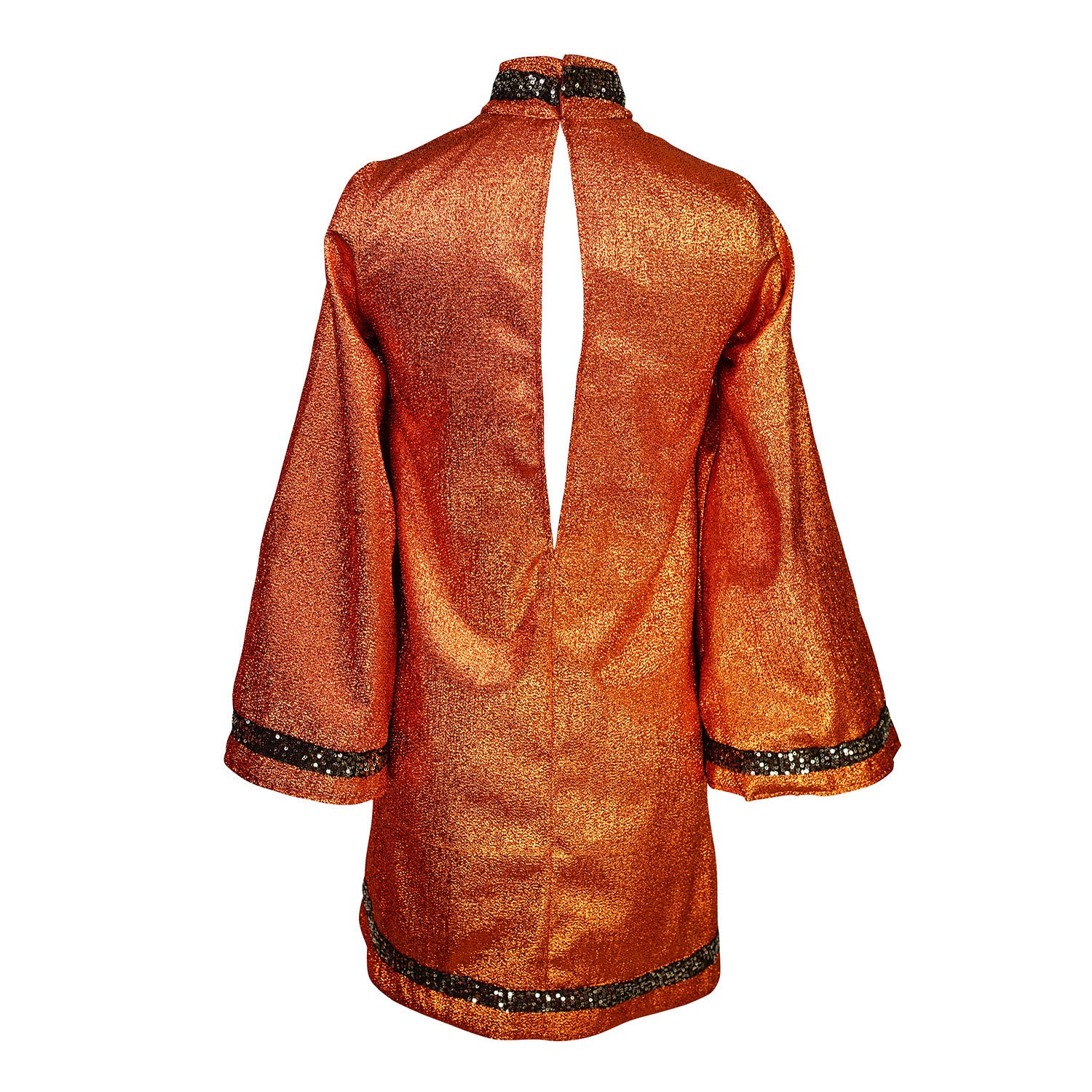 Crafted from a shimmering, fiery orange fabric embellished with an intricate sequin sun and matching sequin details at collar, cuffs, and hem, this is the bold and dreamy 60s revival romance dress every wardrobe craves