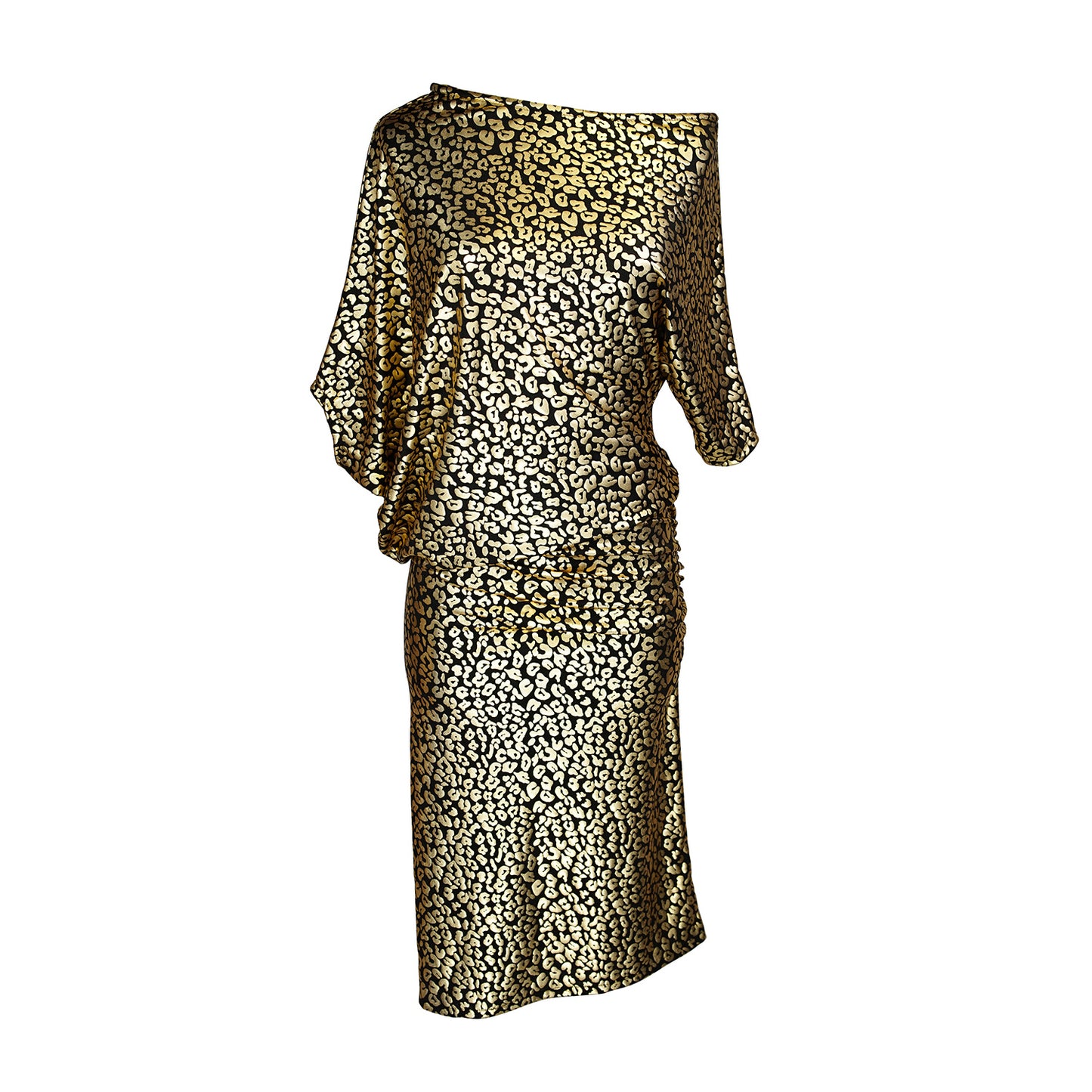 An angle dress made from a gold leopard foil-detailed stretchy jersey, featuring a fitted pencil skirt and light ruching at the hip. The angled sleeves can be arranged for a peek of shoulder and bra strap.