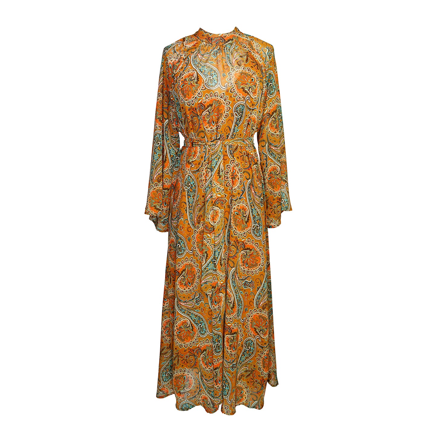 Model wears a soft chiffon midi length dress in caramel brown with turquoise, green and orange paisley print. The sleeves are bell shaped and the dress has a wrap around belt