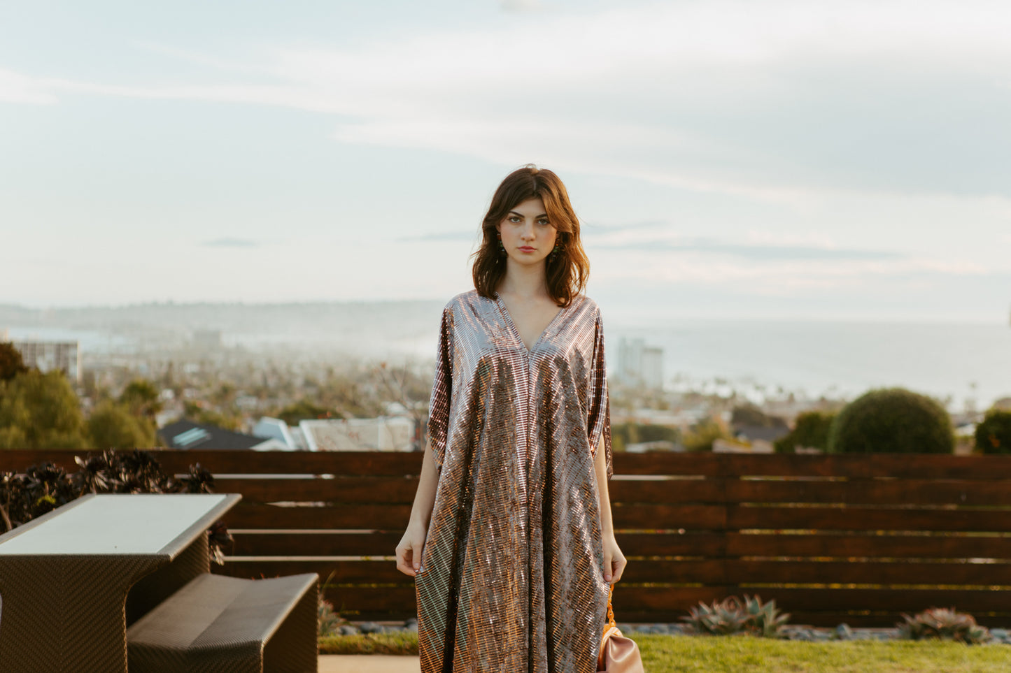 Full length velveteen caftan dress with a geometric metallic rose gold embellishments. Featuring a v-neck, batwing sleeves, and a full length hem. Retro futuristic bohemian style.