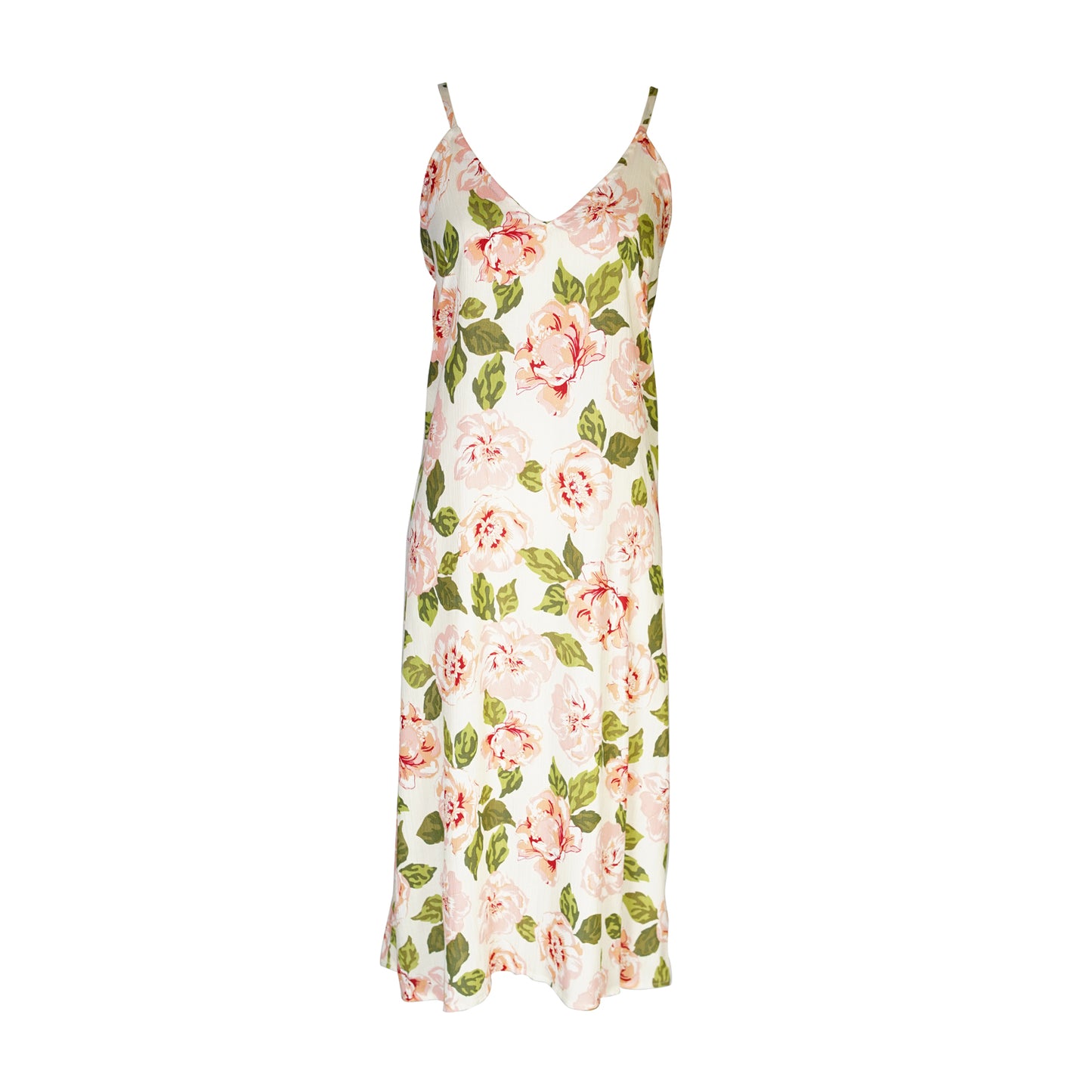 Midi slip dress with an ivory base color, adorned with floral rose print pattern featuring shades of green and pink. It features slender straps with a straight silhouette and relaxed fix, allowing for a beautiful drape and flowy movement. It's designed for a light, airy feel, suitable for warm weather or layered for cooler days.