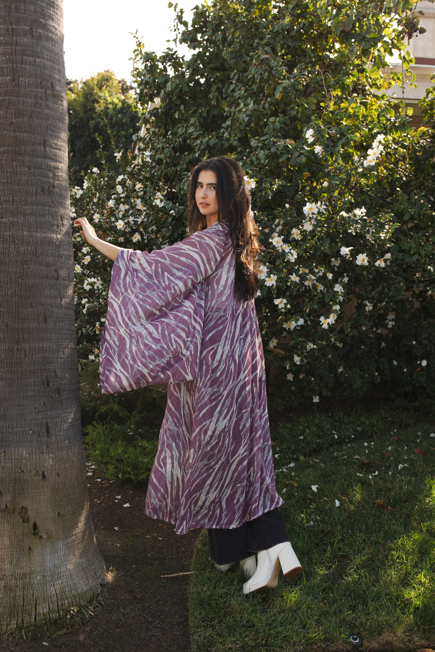 Mauve purple zebra print kimono with belt. Can be worn open as a robe or wrap dress. Long flowy sleeves with ankle hem. Made from semi sheer rayon chiffon fabric.