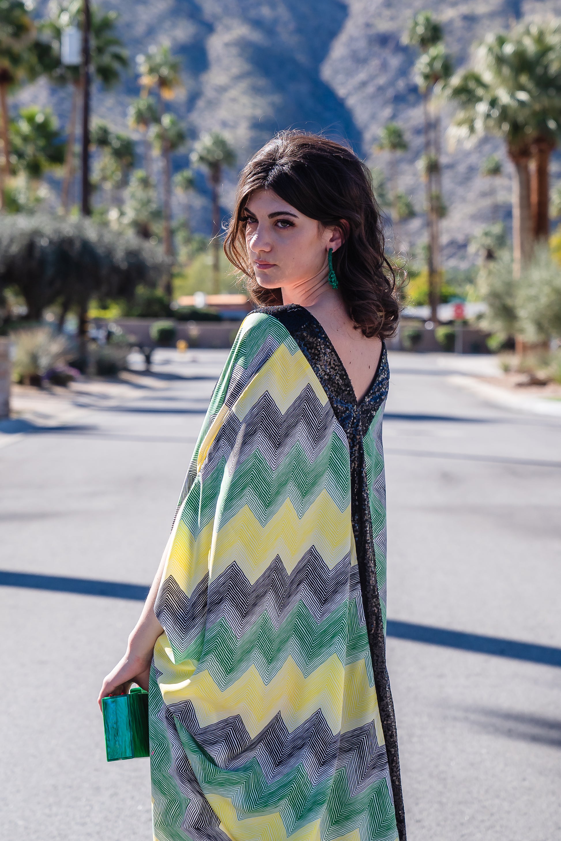 Jennafer Grace Fortuna Deluxe caftan black green yellow white striped chevron print with black sequin lapel down front and back, creating a Y shaped design. V neck with batwing sleeves and ankle length hem.  Unisex handmade in California USA