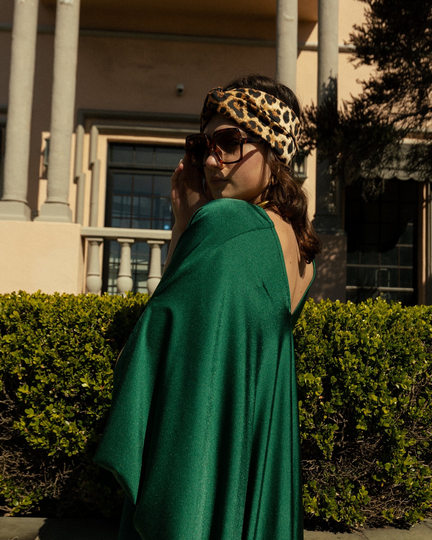 Elegant emerald green caftan made from jersey. Features a v-neck, batwing sleeves, and ankle hem.