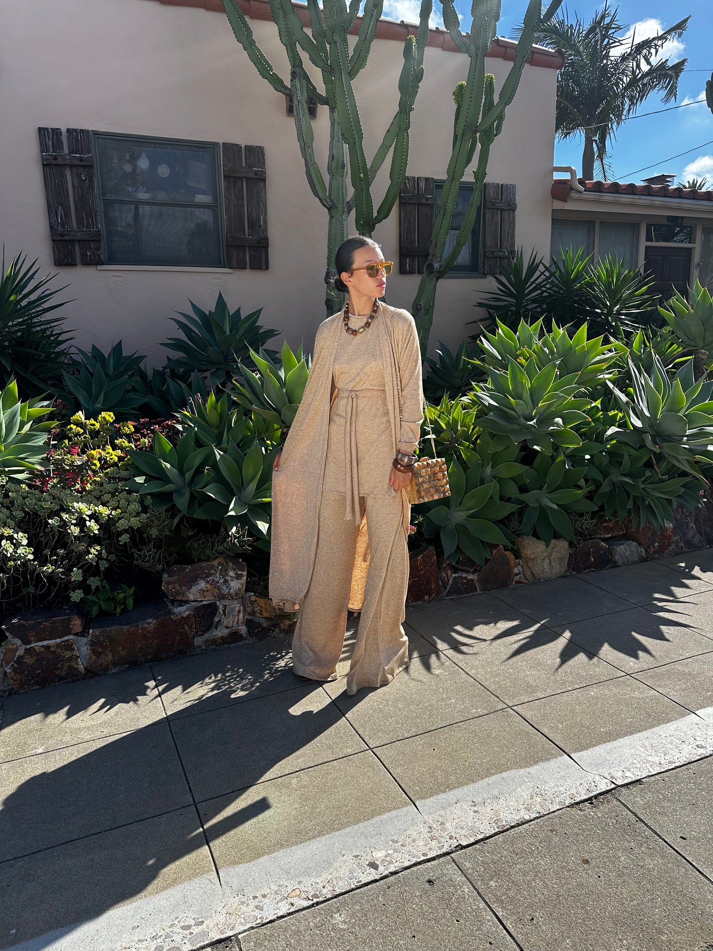This versatile yoga duster was handmade in Southern California with an ultra soft and stretchy deep cream colored brushed bamboo blend jersey.