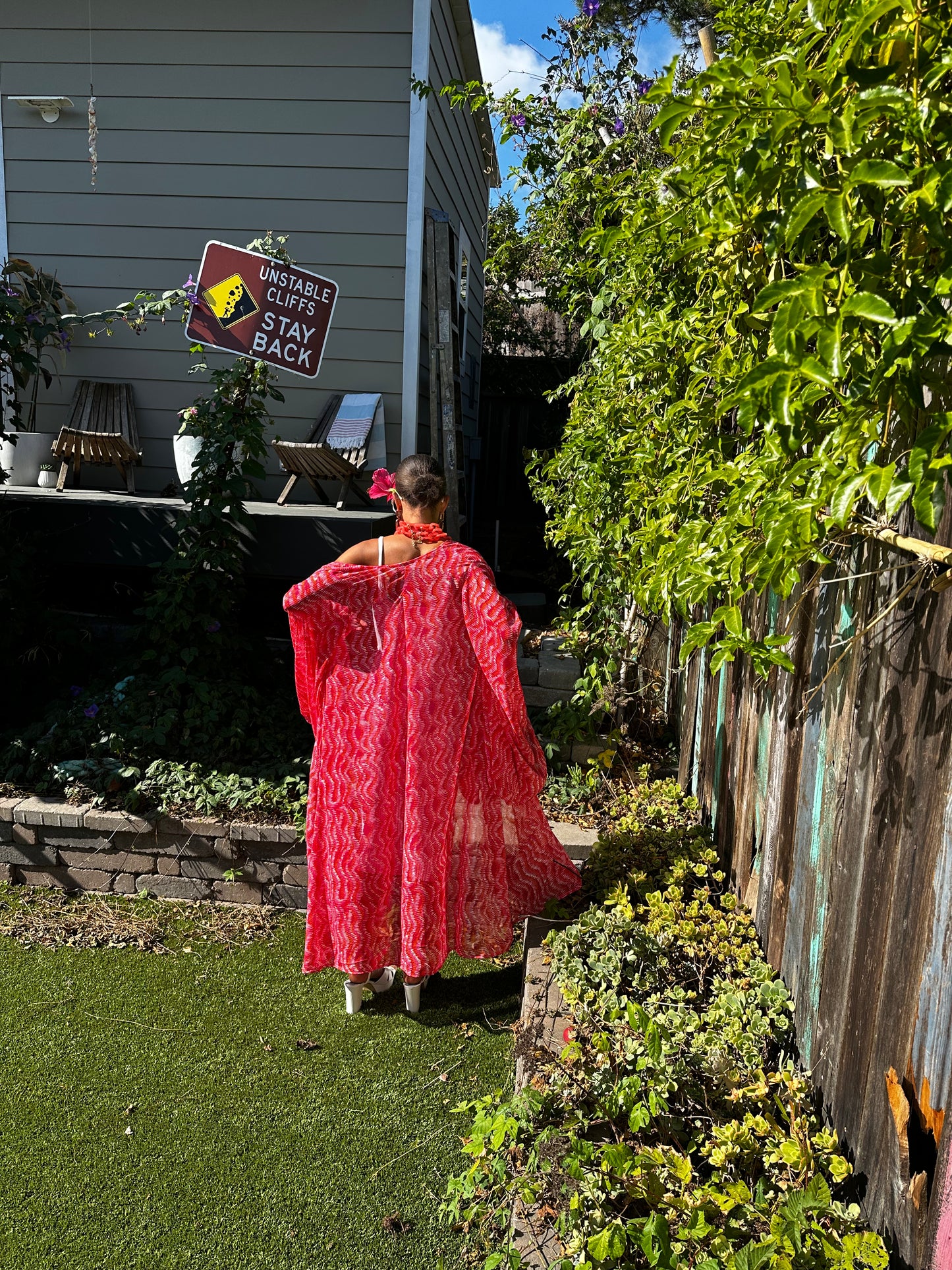 This bold bright kimono was handmade in San Diego, CA with a soft semi sheer rayon chiffon. Featuring pockets and a matching waist tie-you can style this piece in at least 10 ways!
