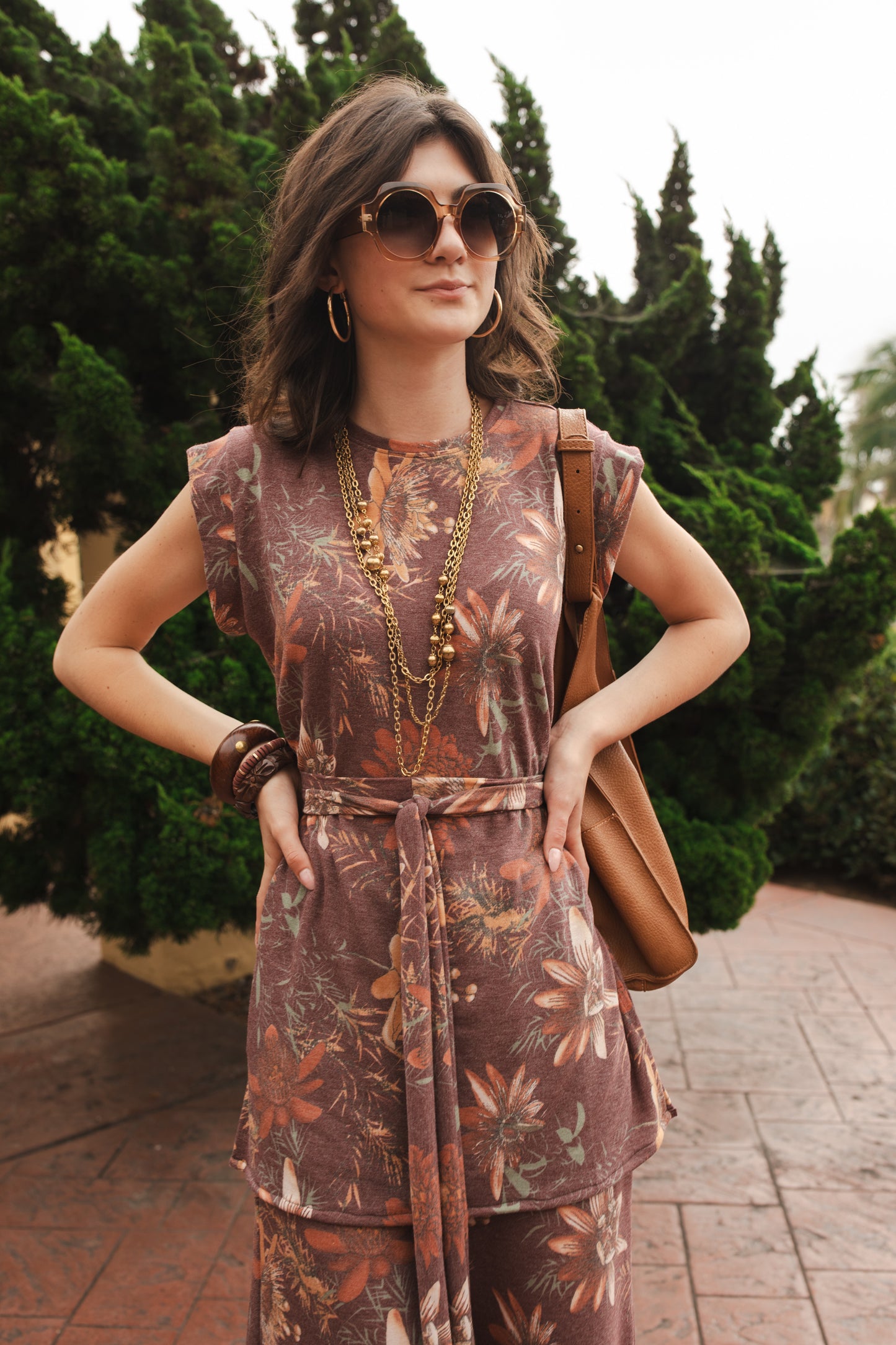 Tunic top and palazzo pant set made from a luxe jersey. Muted red base with orange floral print. Featuring tab sleeves, side slits and an extended obi-style belt on the top, and pockets, elastic waist and a soft hidden drawstring on the bottoms.