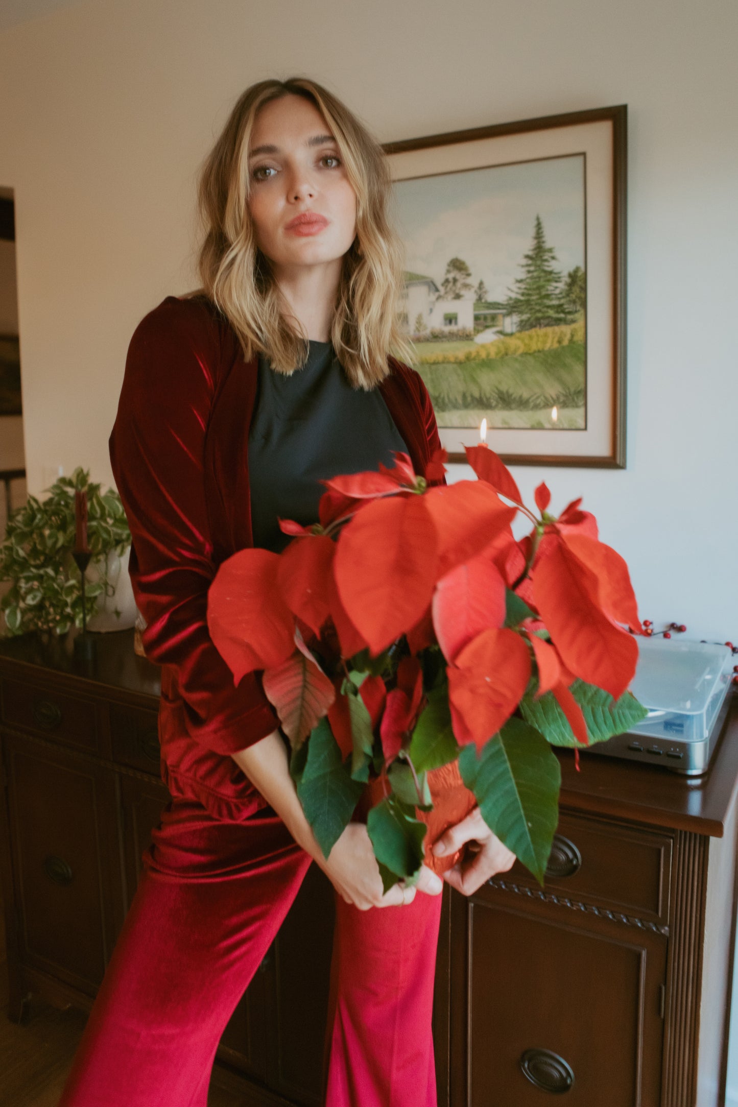 Rich oxblood red velvet bellbottom pants. Featuring a high waist and flared ends in a rich stretch velvet fabric.