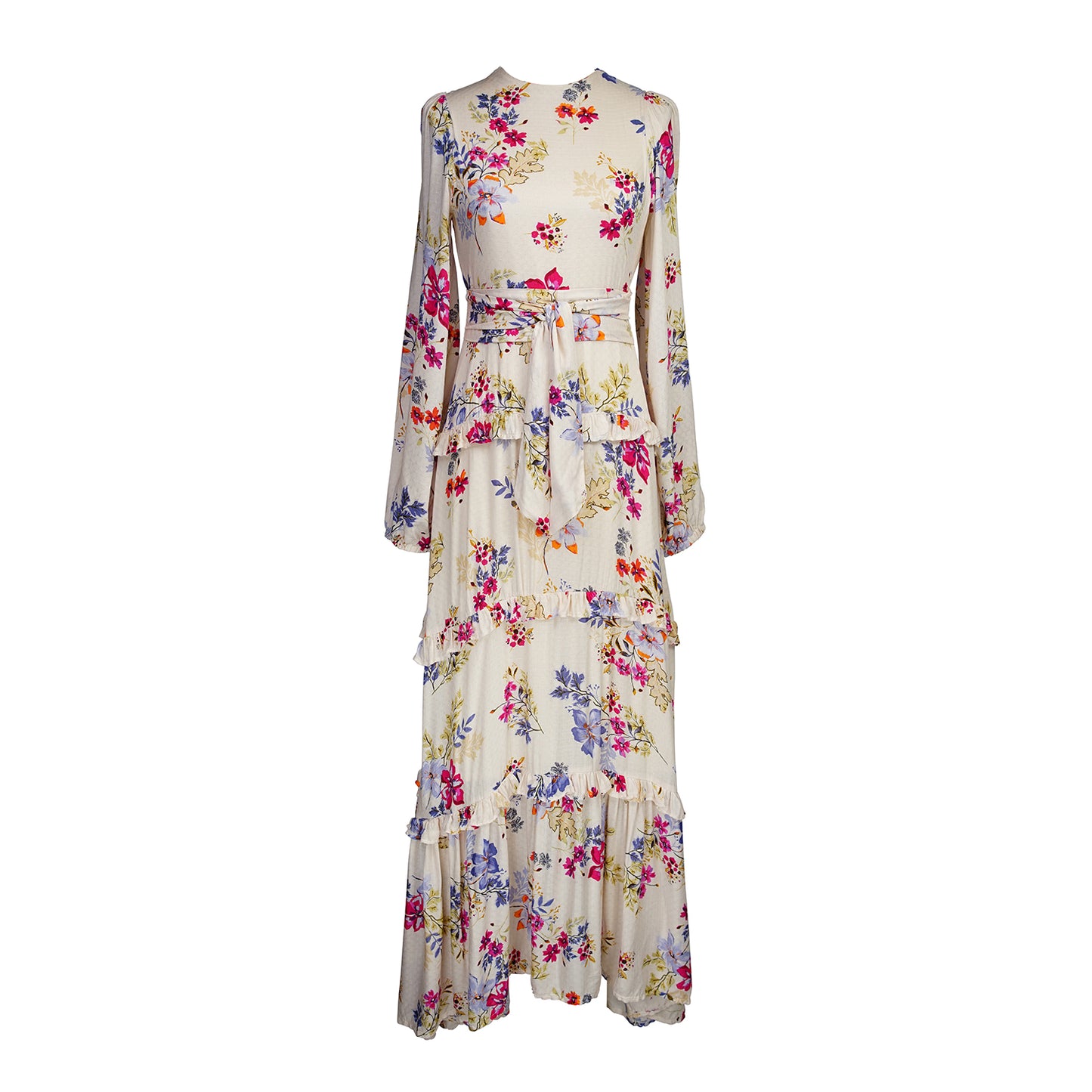 A floral maxi dress made from a soft, linen like crepe, it features high neck, bishop sleeves, tiered ruffle skirt and matching sash for a cinched waist. It's light, airy silhouette. Base color is pale yellow with a mixture of fuchsia, orange, and blue flowers as the print.