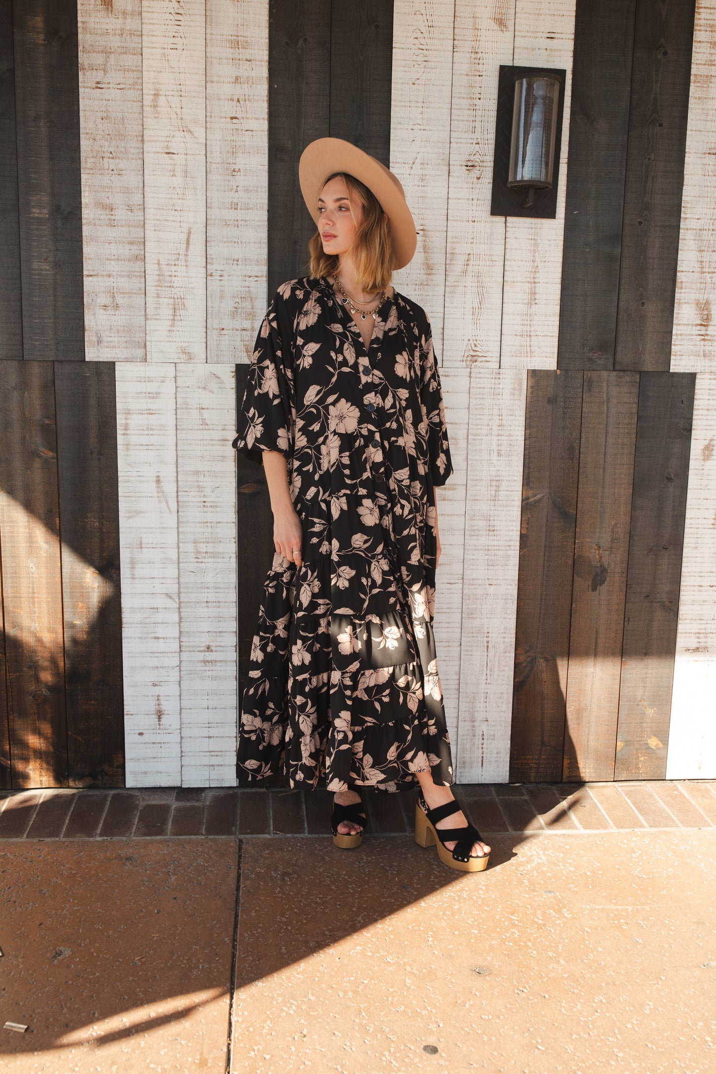 This beautiful maxi dress is made from a feminine floral fabric and comes with an optional sash belt.