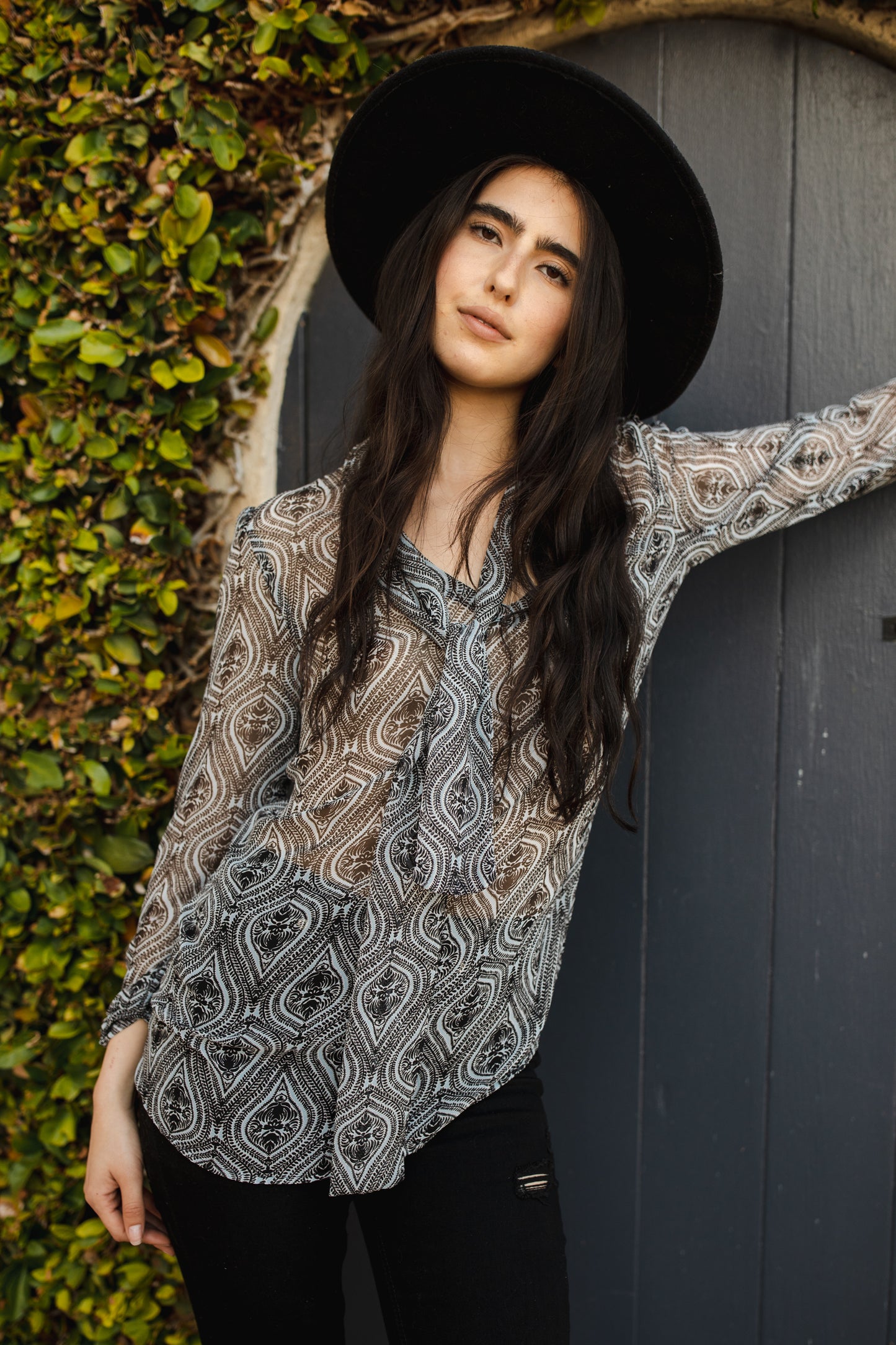 Semi-sheer, black and pale blue modern artistic paisley patterned chiffon blouse featuring long bishop sleeves, v-neck, and neck tie sash. Retro rock n' roll bohemian pussybow, bow-tie blouse.