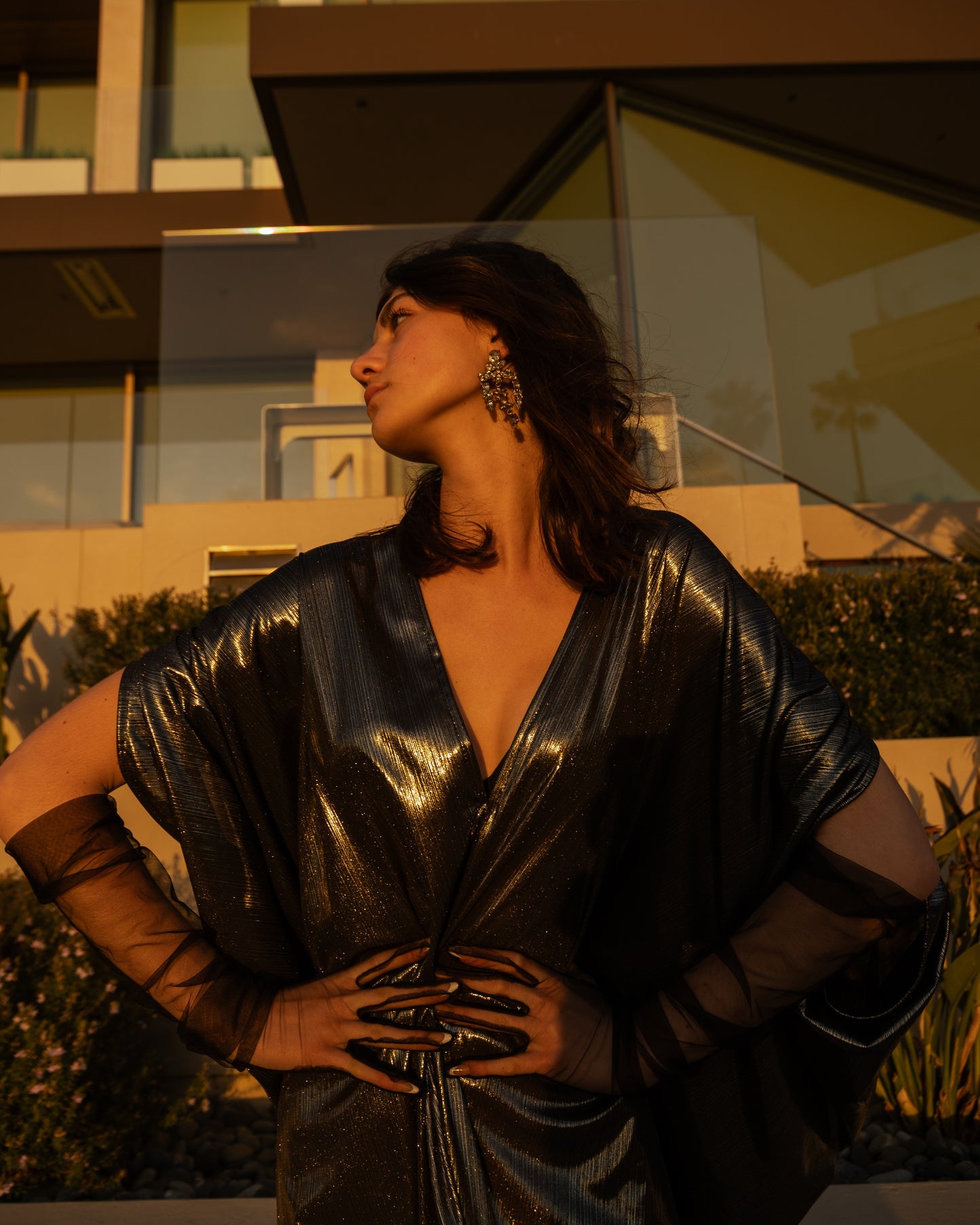 A stunning metallic caftan crafted from a slinky black jersey coated in a gorgeous mercurial foil