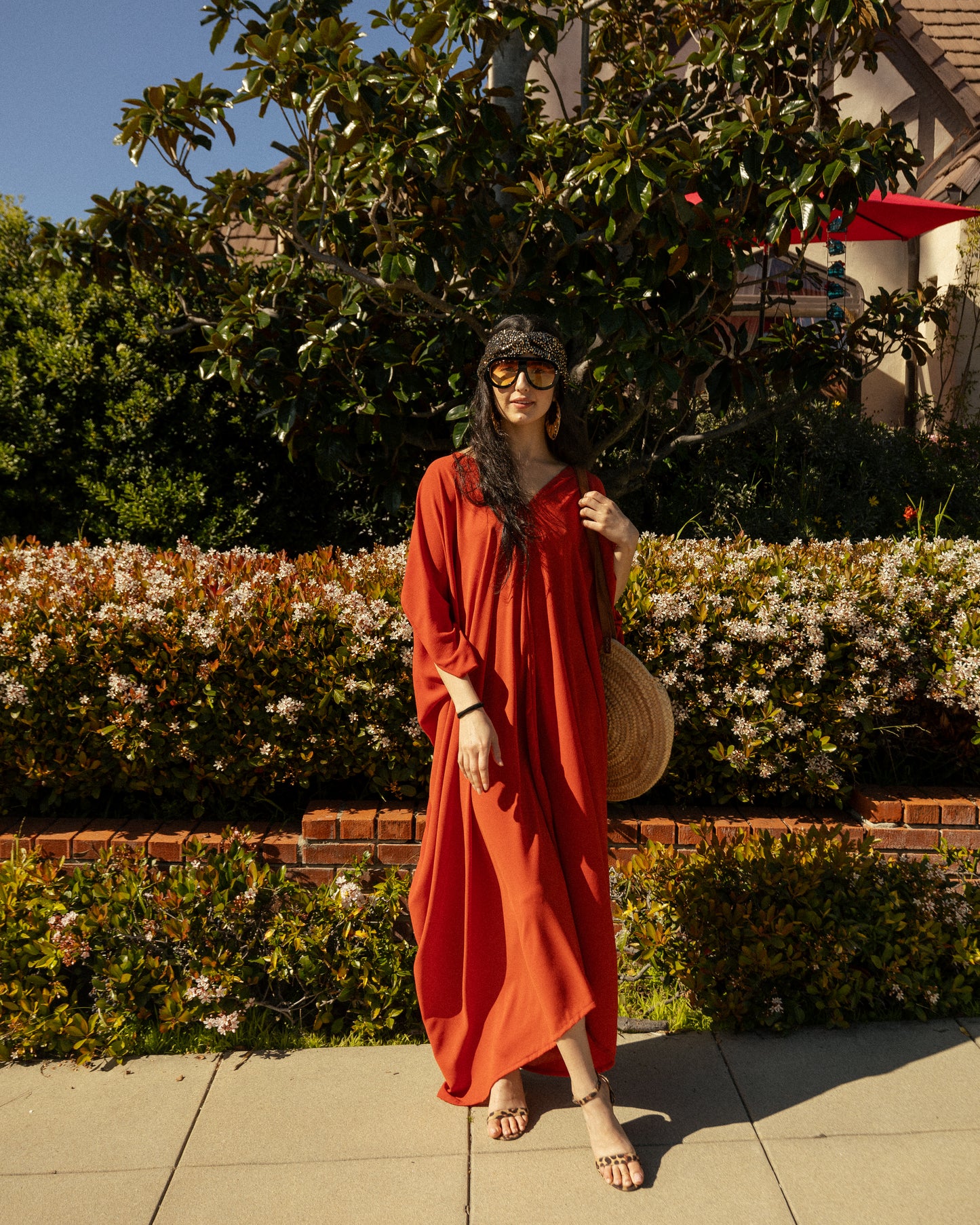 This caftan is made with a generous amount of a super luxe and ultra light rust orange bubble crepe georgette