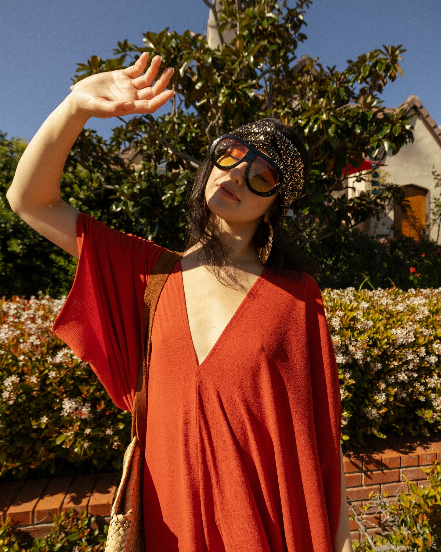 This caftan is made with a generous amount of a super luxe and ultra light rust orange bubble crepe georgette