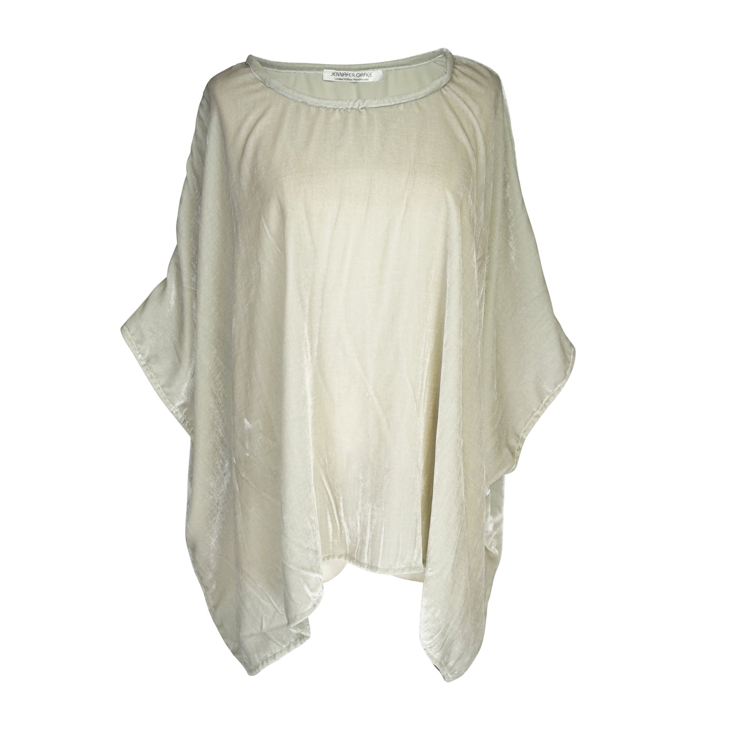 This pale sage green scarf top is a bohemian-inspired piece designed to drape elegantly on any shape. It features a boat neck, dolman sleeves, and a relaxed, flowy silhouette. Crafted with an incredibly soft silk velvet with a subtle shimmer that catches the light.