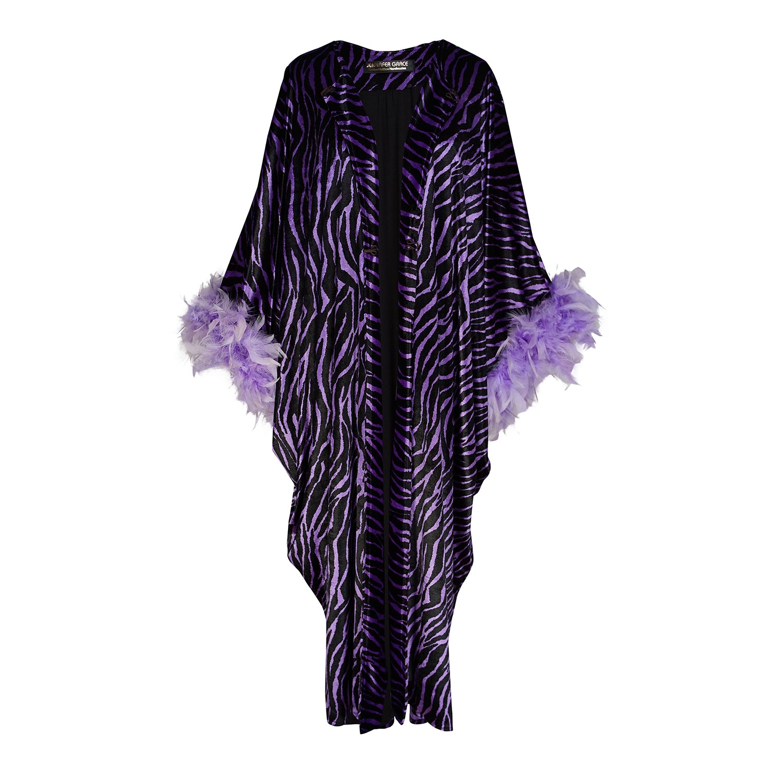 Velvet zebra print overcoat with periwinkle purple. Featuring light purple feathers around sleeve hem, two hook and eye closures at neck and bust. Batwing sleeves with lots of flow and room. Ankle length hem.