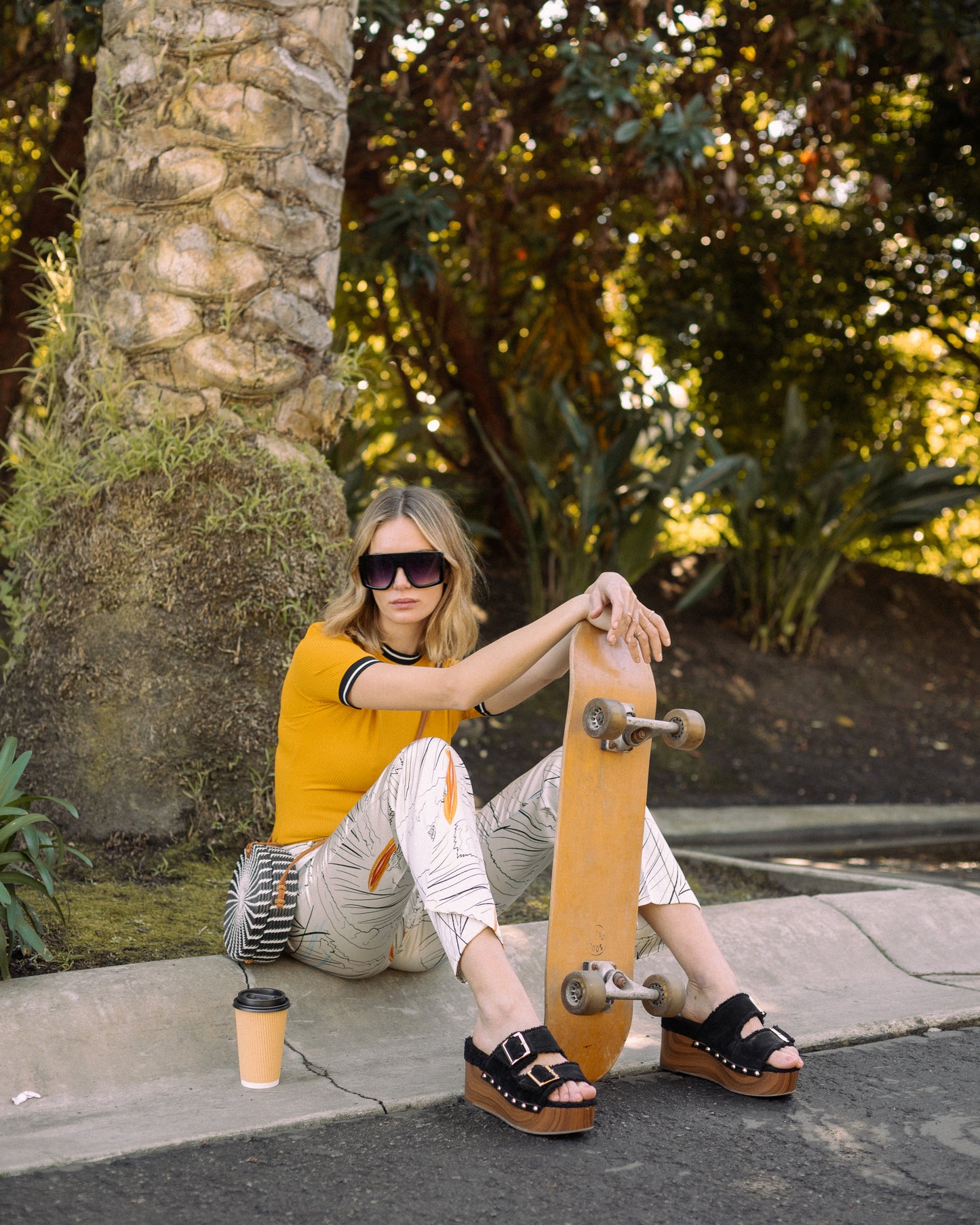Channel your inner risk-taker in our Venusian Silk Trousers. Made of luxurious silk satin, these cream-colored trousers feature a bold out of this world Surfer/UFO print that will make you stand out