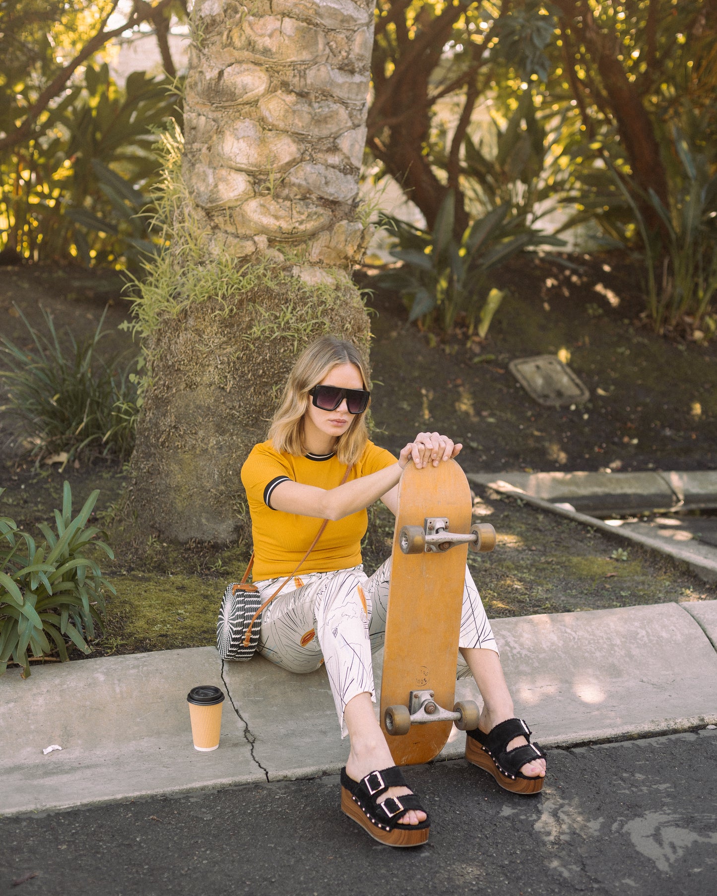 Channel your inner risk-taker in our Venusian Silk Trousers. Made of luxurious silk satin, these cream-colored trousers feature a bold out of this world Surfer/UFO print that will make you stand out