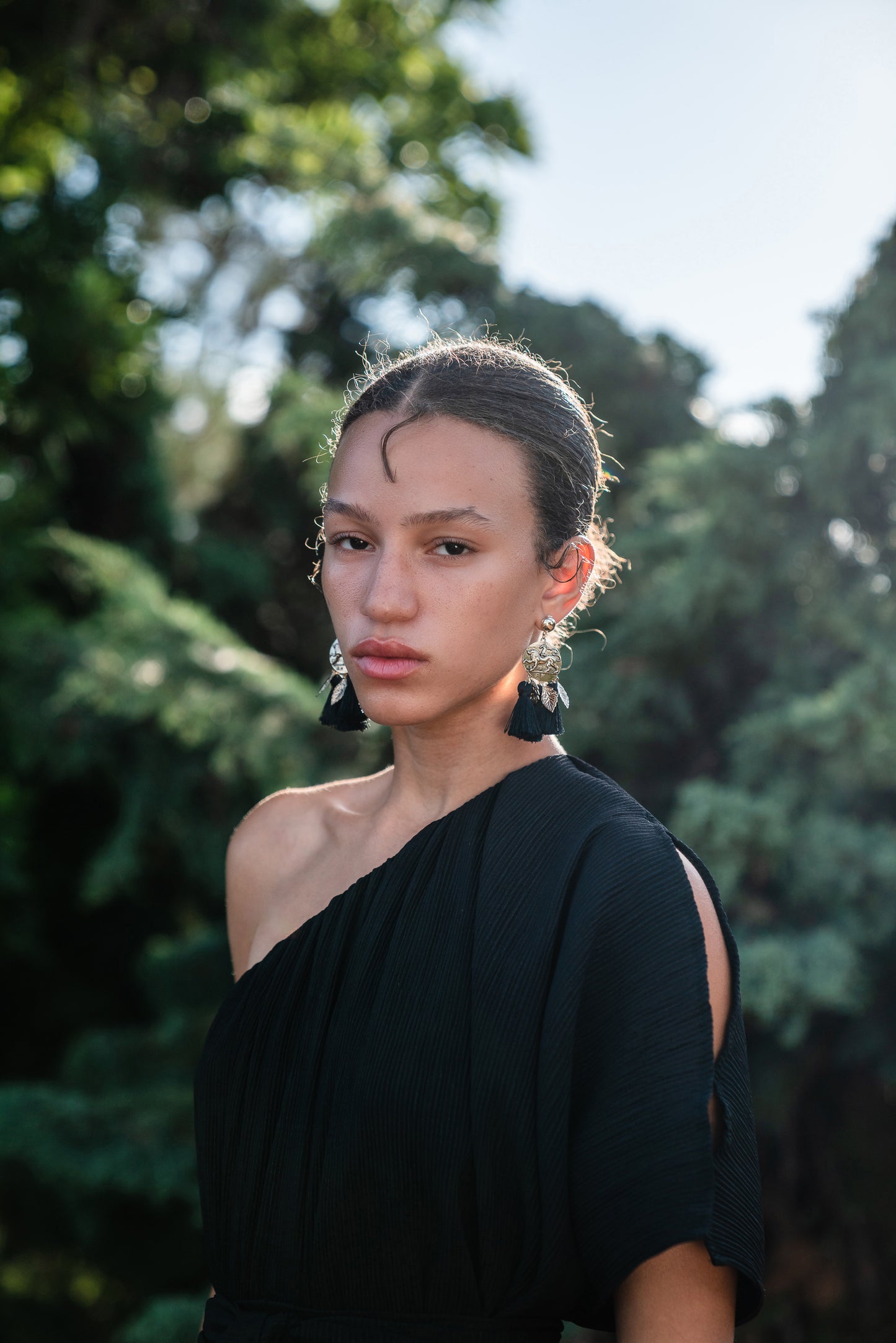 Effortlessly elegant, the Black Diamond Pleated Maxi Dress features a flattering one shoulder design with a long Obi style belt. The pleated details and shimmering sequins add texture and movement, while the flared silhouette and ruffle hem create a feminine and sophisticated look.