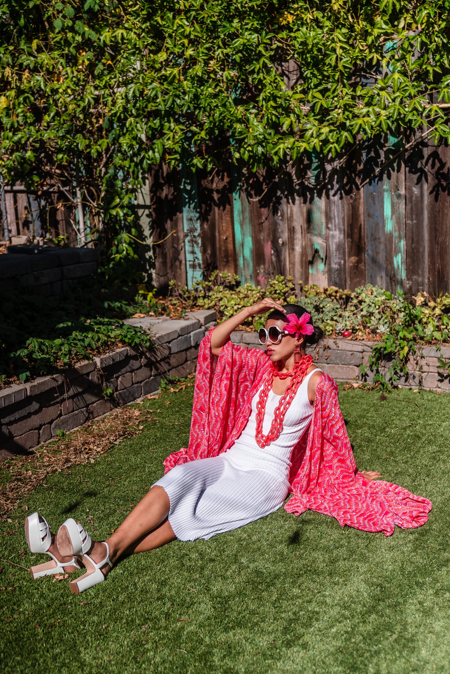 This bold bright kimono was handmade in San Diego, CA with a soft semi sheer rayon chiffon. Featuring pockets and a matching waist tie-you can style this piece in at least 10 ways!