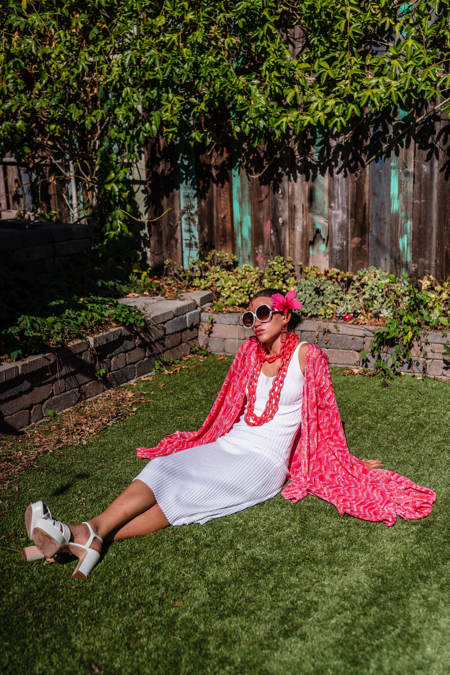 This bold bright kimono was handmade in San Diego, CA with a soft semi sheer rayon chiffon. Featuring pockets and a matching waist tie-you can style this piece in at least 10 ways!