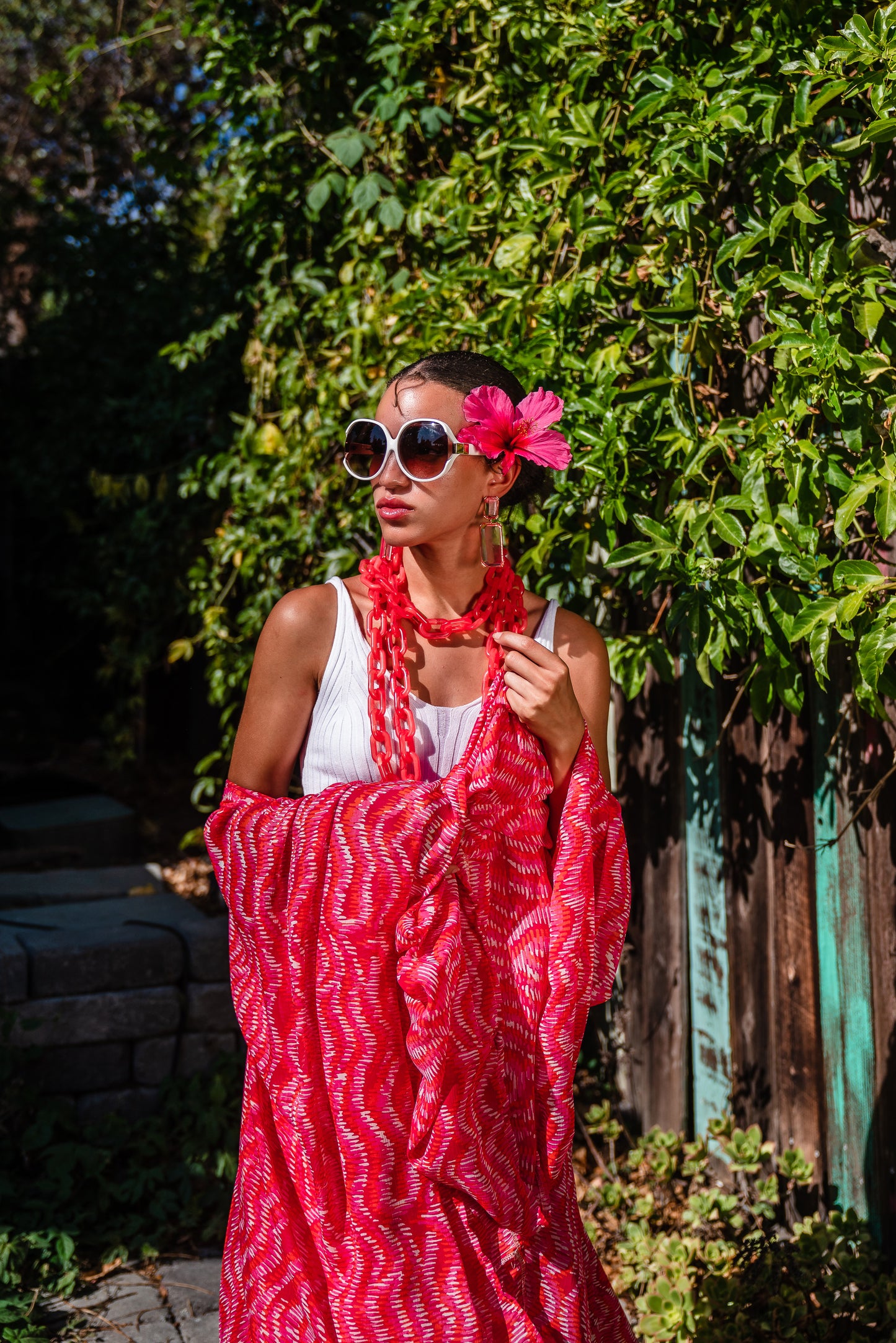 This bold bright kimono was handmade in San Diego, CA with a soft semi sheer rayon chiffon. Featuring pockets and a matching waist tie-you can style this piece in at least 10 ways!