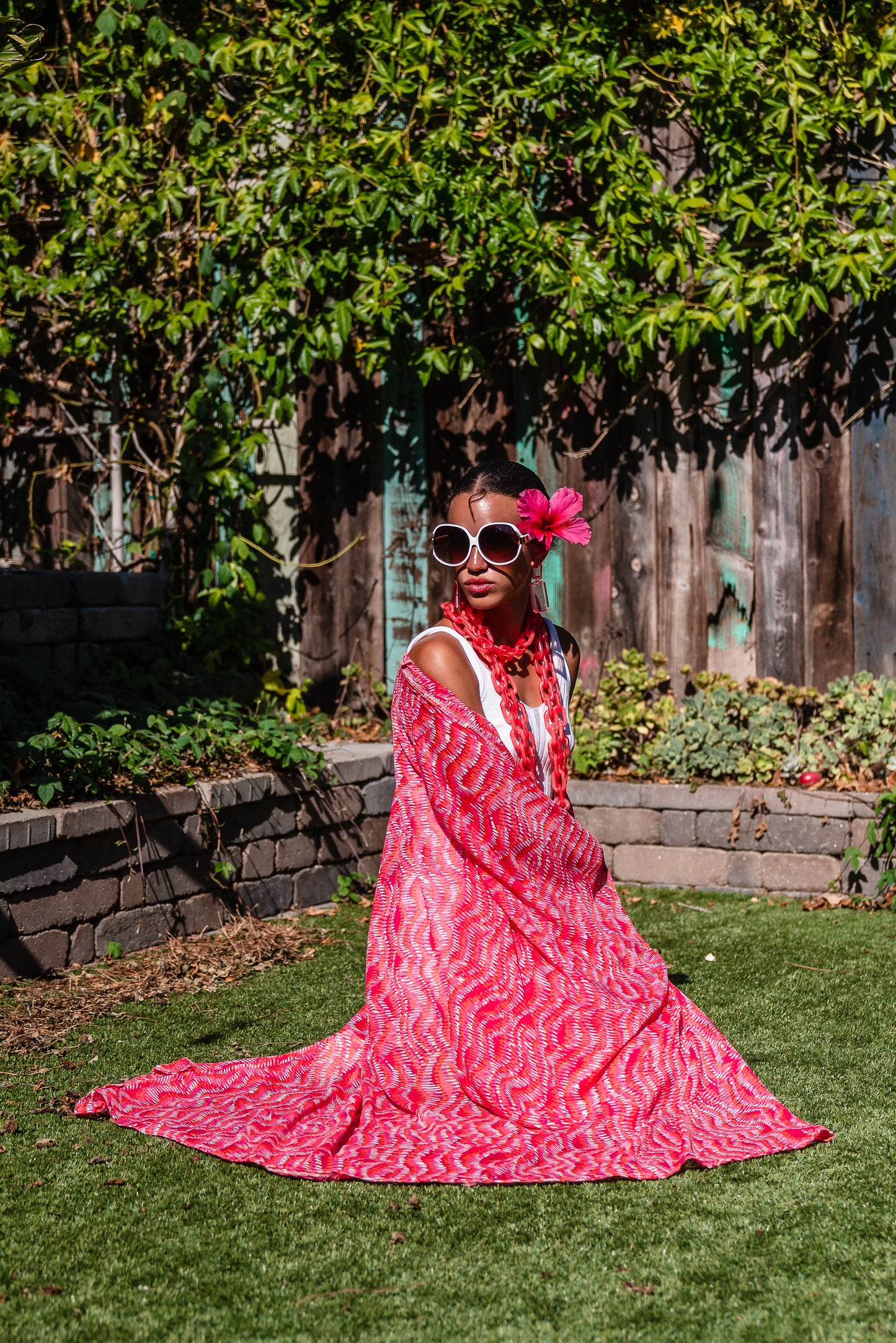 This bold bright kimono was handmade in San Diego, CA with a soft semi sheer rayon chiffon. Featuring pockets and a matching waist tie-you can style this piece in at least 10 ways!