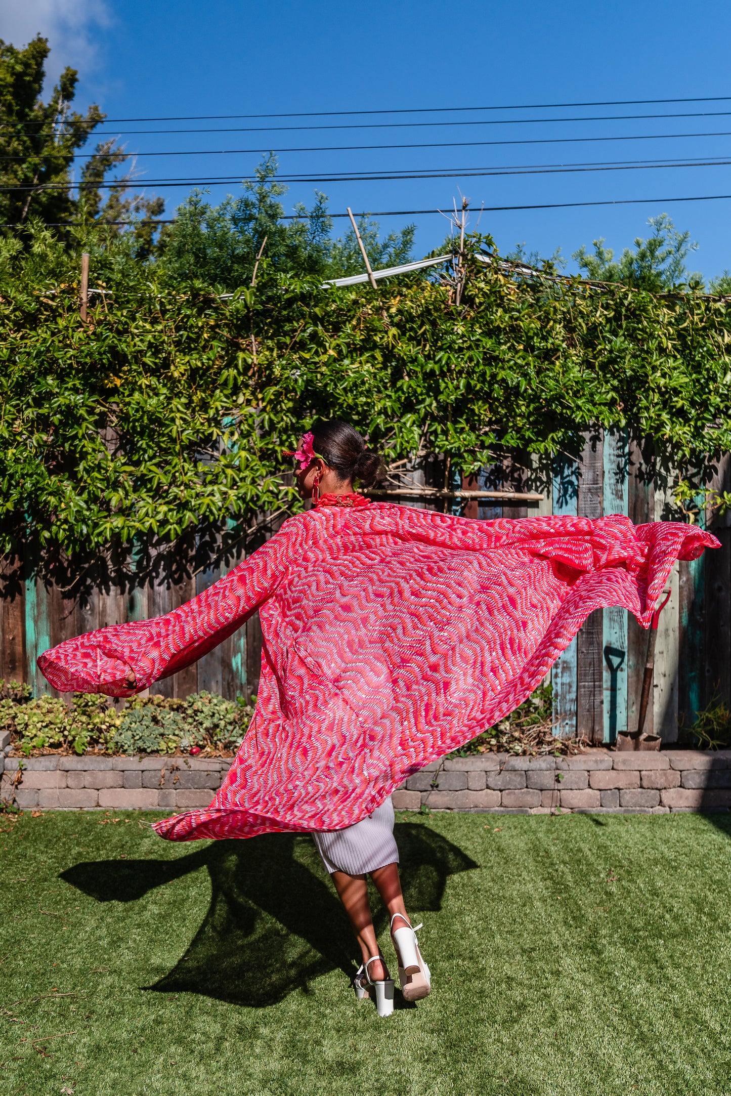 This bold bright kimono was handmade in San Diego, CA with a soft semi sheer rayon chiffon. Featuring pockets and a matching waist tie-you can style this piece in at least 10 ways!