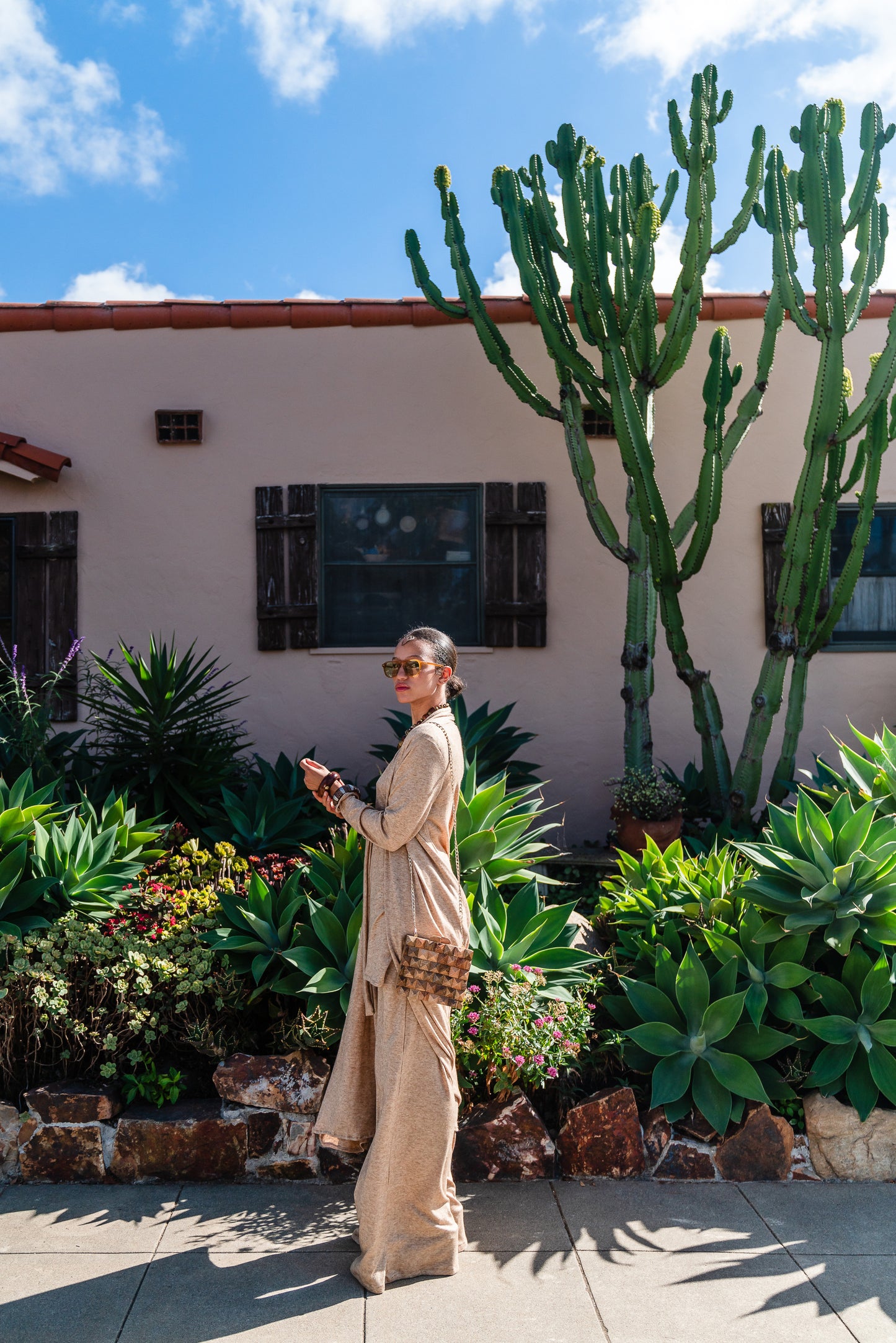 This versatile yoga duster was handmade in Southern California with an ultra soft and stretchy deep cream colored brushed bamboo blend jersey.