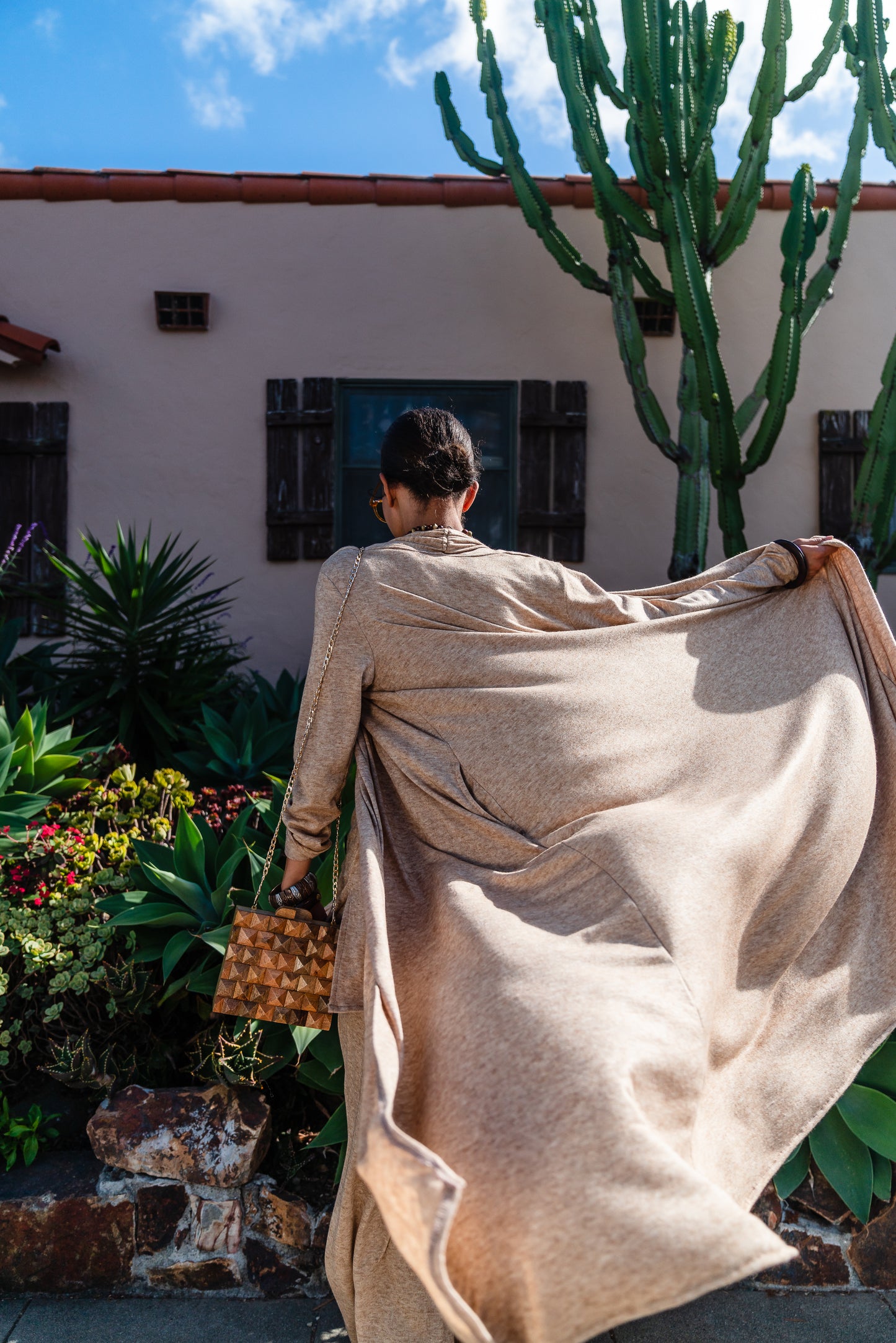 This versatile yoga duster was handmade in Southern California with an ultra soft and stretchy deep cream colored brushed bamboo blend jersey.