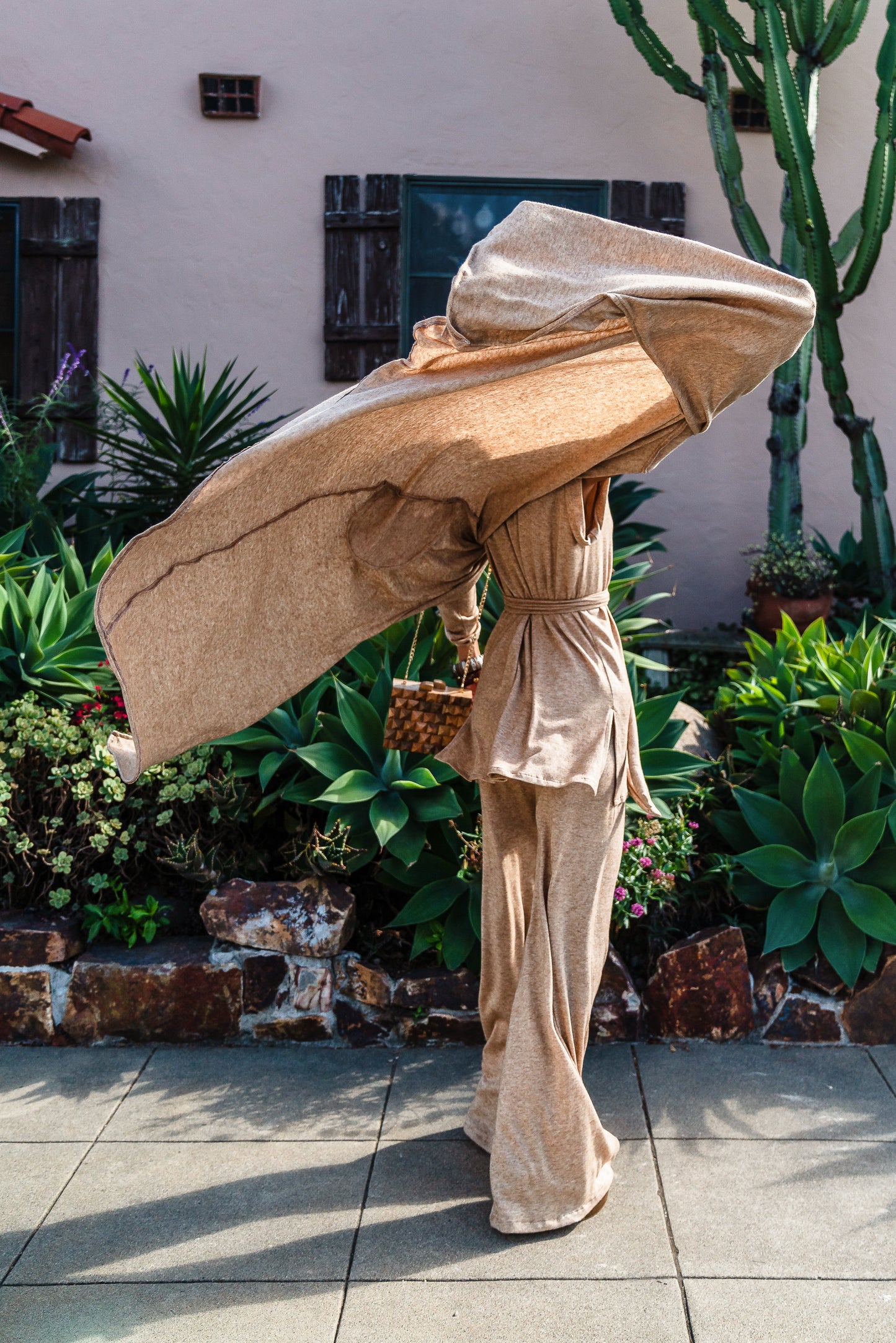 This versatile yoga duster was handmade in Southern California with an ultra soft and stretchy deep cream colored brushed bamboo blend jersey.