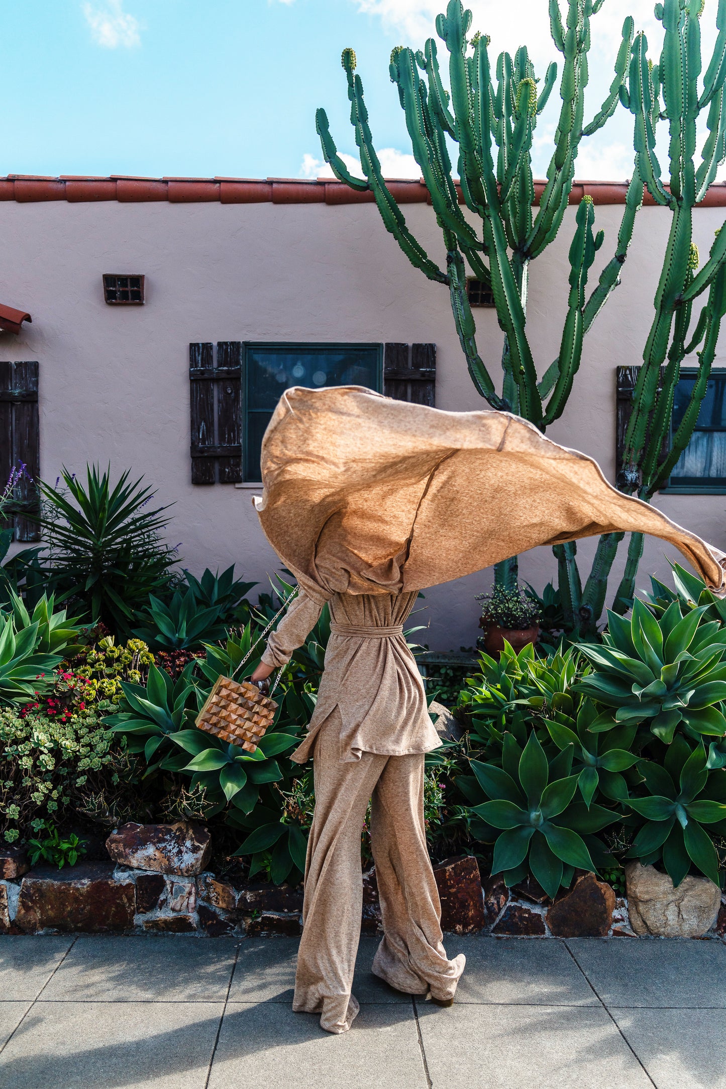 This versatile yoga duster was handmade in Southern California with an ultra soft and stretchy deep cream colored brushed bamboo blend jersey.