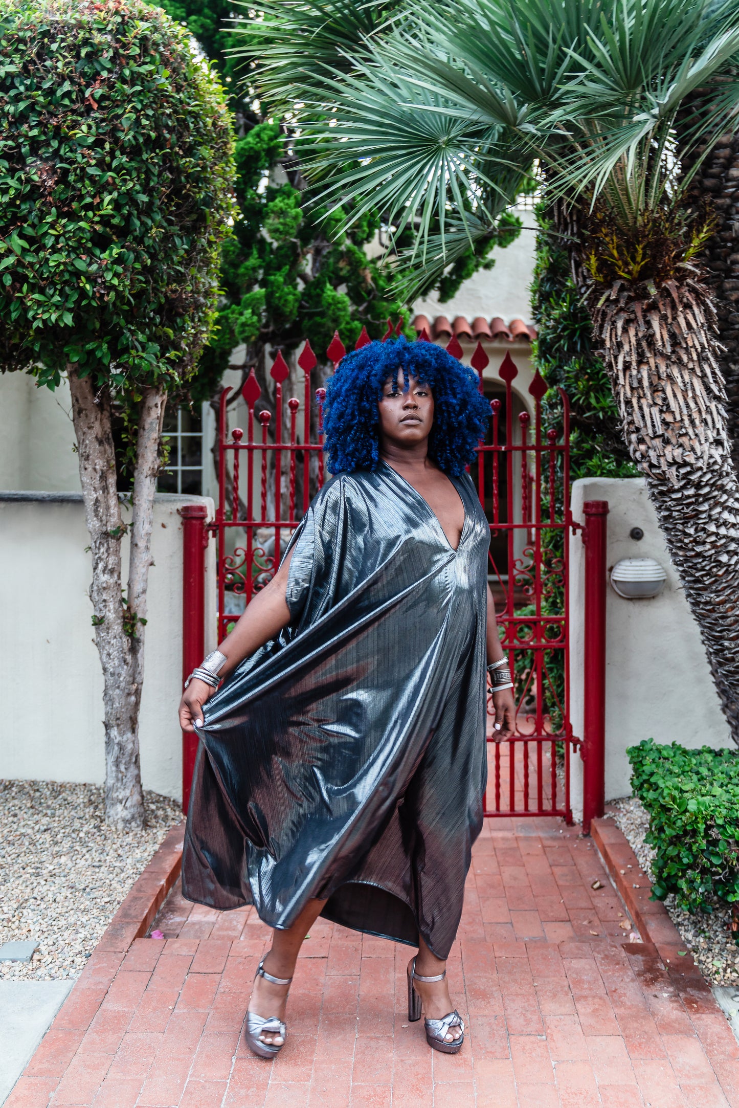 A stunning metallic caftan crafted from a slinky black jersey coated in a gorgeous mercurial foil