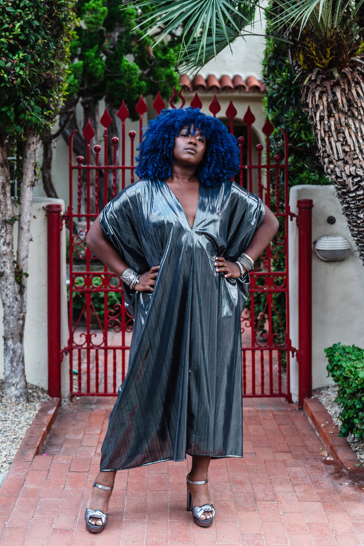 A stunning metallic caftan crafted from a slinky black jersey coated in a gorgeous mercurial foil
