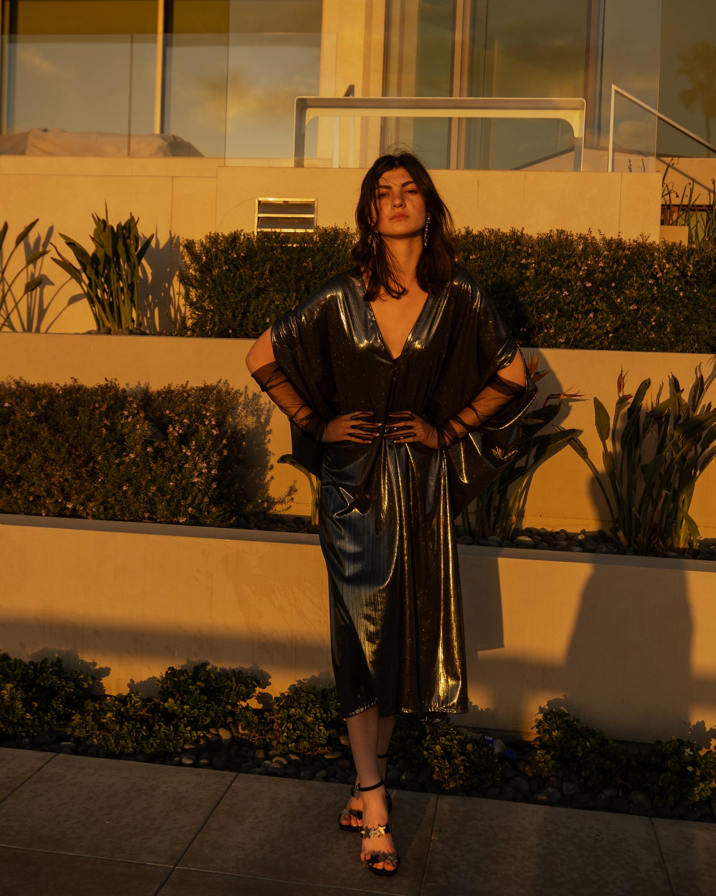 A stunning metallic caftan crafted from a slinky black jersey coated in a gorgeous mercurial foil