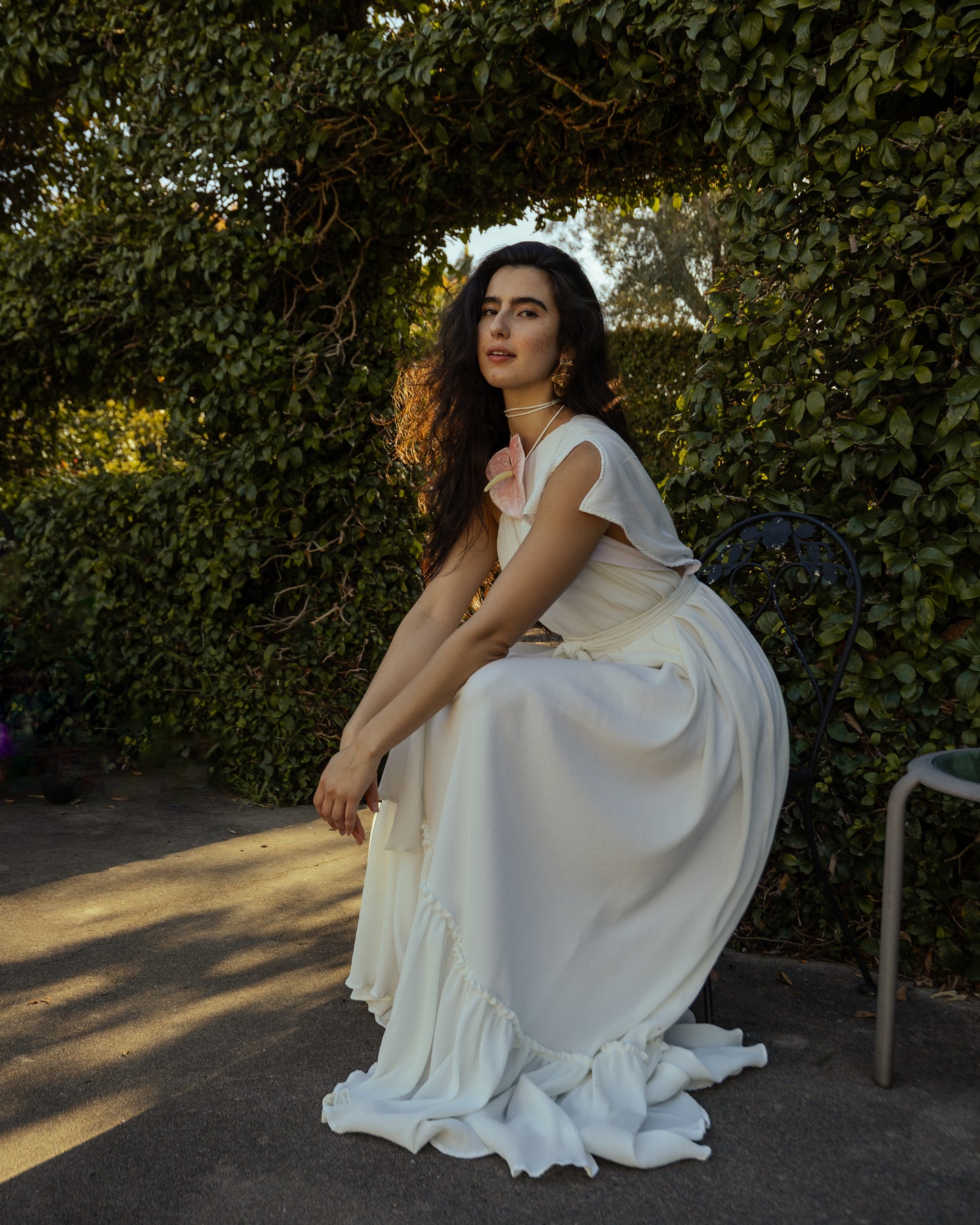 Effortlessly elegant, the Ivory Pleated Maxi Dress features a flattering one shoulder design and understated ivory. The pleated details add texture and movement, while the flared silhouette and ruffle hem create a feminine and sophisticated look.