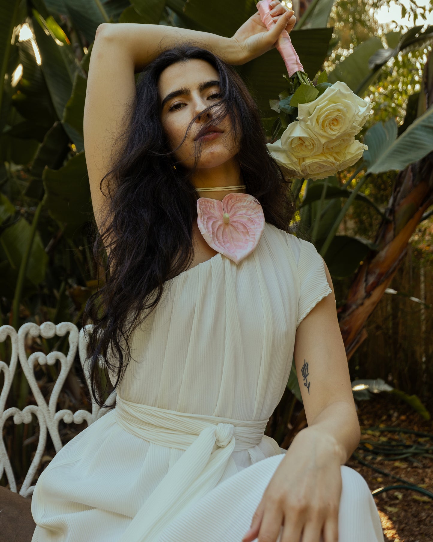 Effortlessly elegant, the Ivory Pleated Maxi Dress features a flattering one shoulder design and understated ivory. The pleated details add texture and movement, while the flared silhouette and ruffle hem create a feminine and sophisticated look.