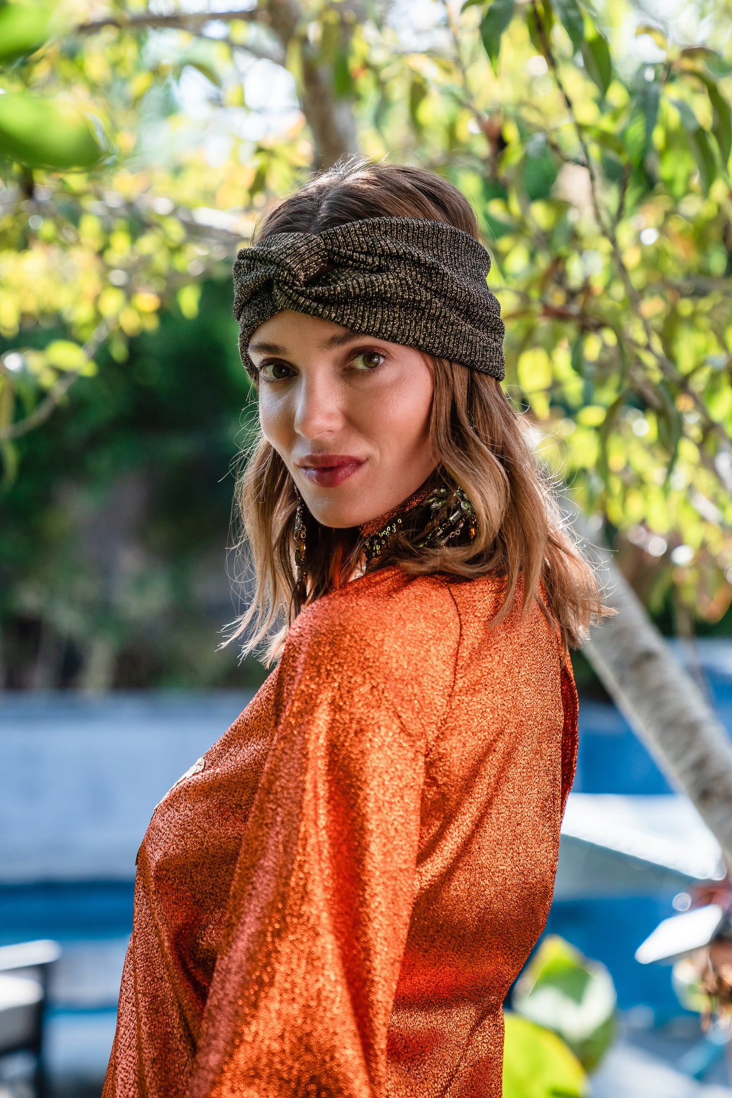 Crafted from a shimmering, fiery orange fabric embellished with an intricate sequin sun and matching sequin details at collar, cuffs, and hem, this is the bold and dreamy 60s revival romance dress every wardrobe craves