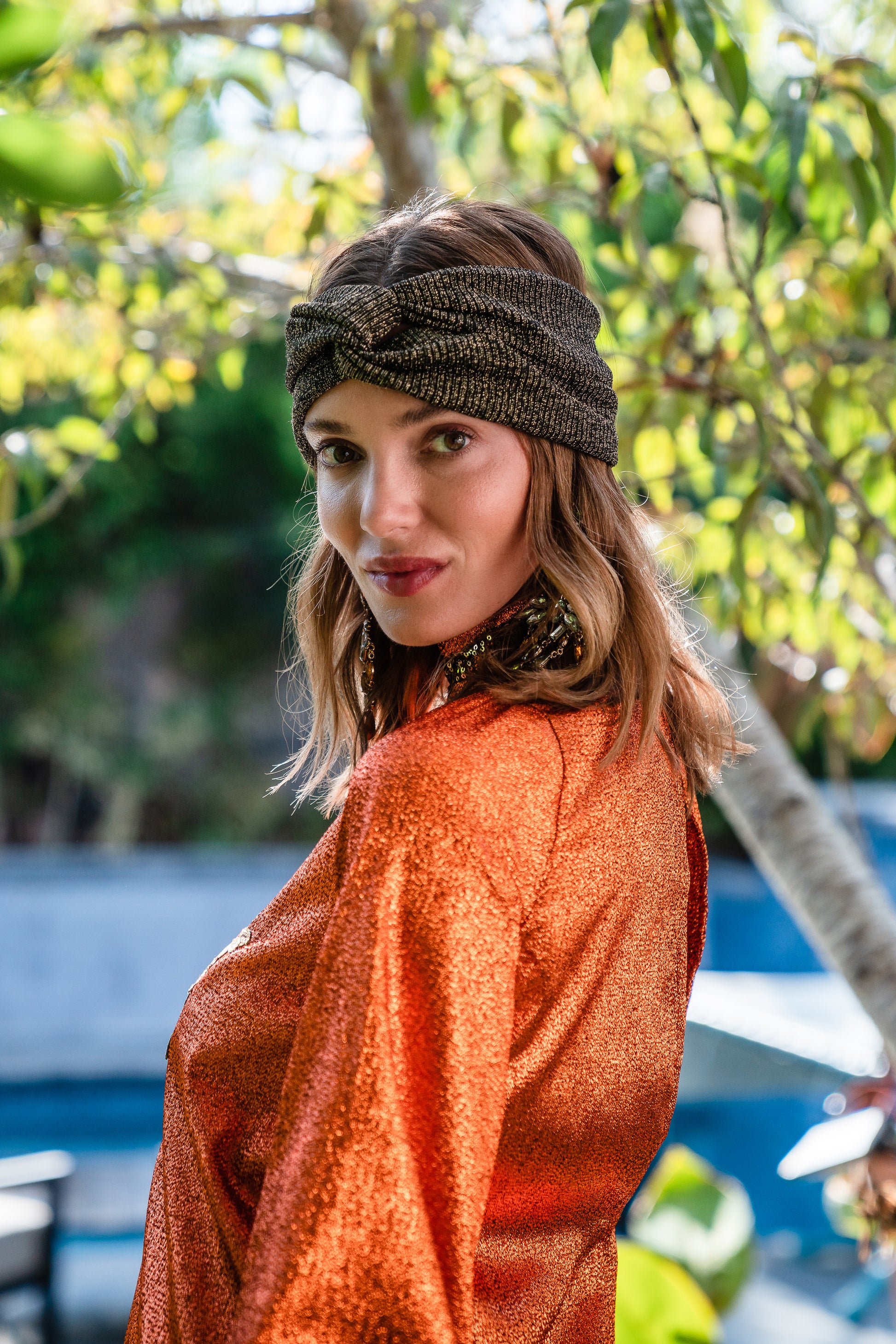 Crafted from a shimmering, fiery orange fabric embellished with an intricate sequin sun and matching sequin details at collar, cuffs, and hem, this is the bold and dreamy 60s revival romance dress every wardrobe craves