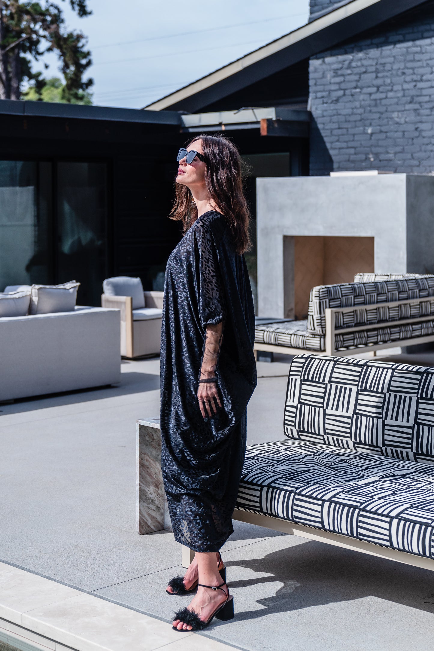 This caftan is made from a black rayon burn out velvet fabric and features leopard print pattern, deep v neckline, batwing sleeves, and ankle length hem.